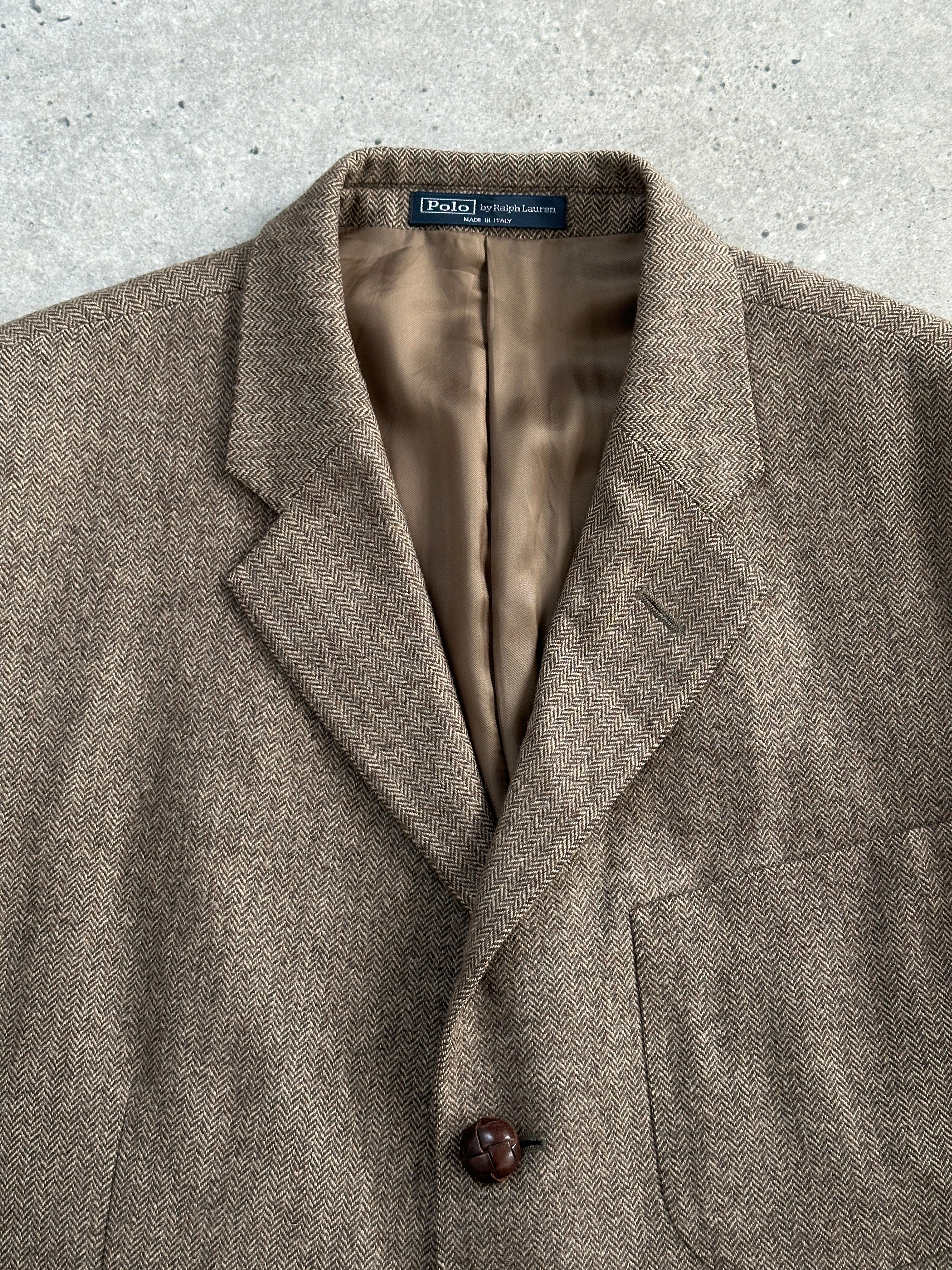 Ralph Lauren Polo 2010s pure wool herringbone blazer in size 44R/XL, tailored fit with classic herringbone pattern and notch lapel