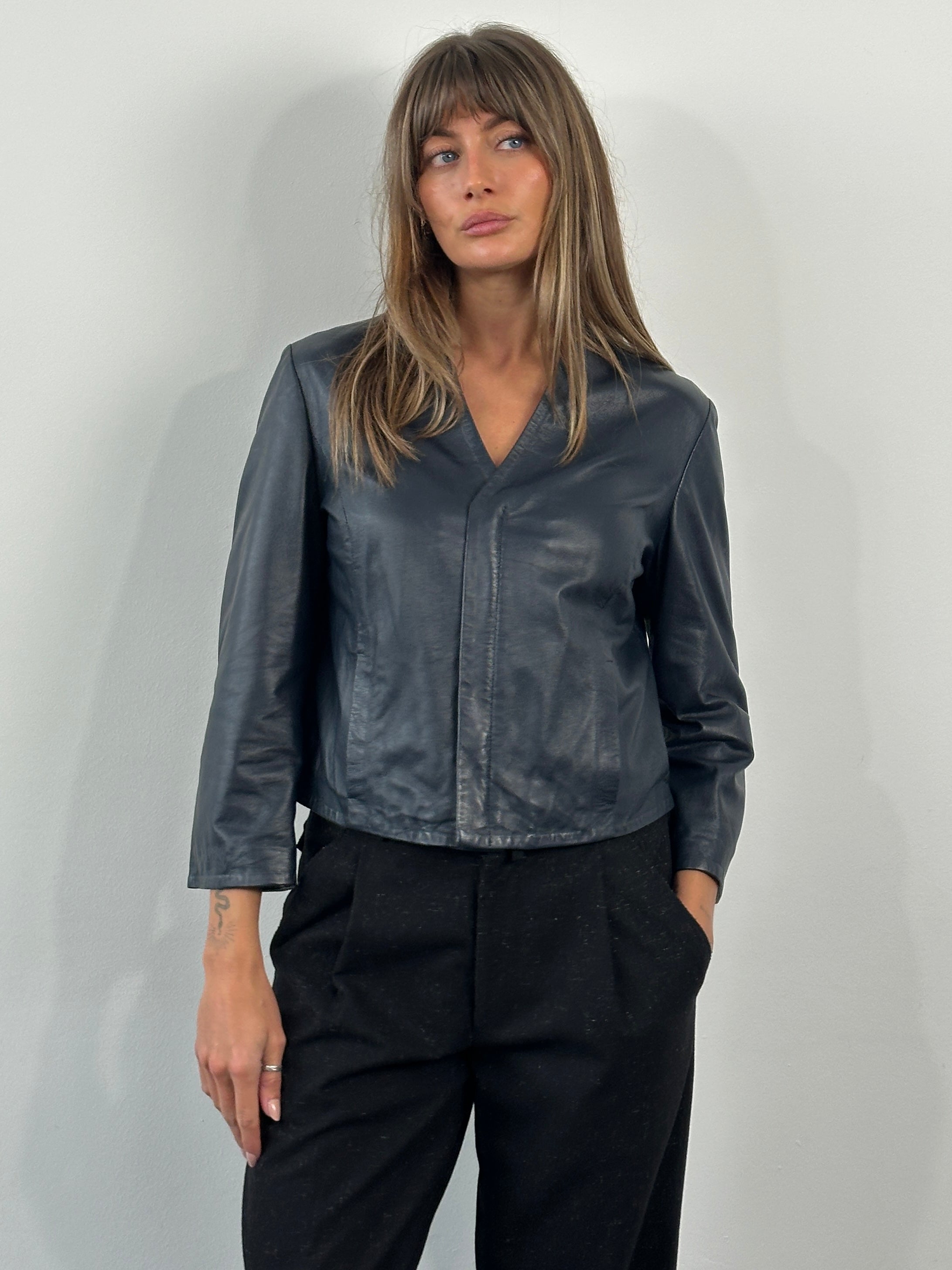 Armani Jeans 2000s lamb leather jacket in size S, black with classic stitching and sleek design, displayed on a hanger.
