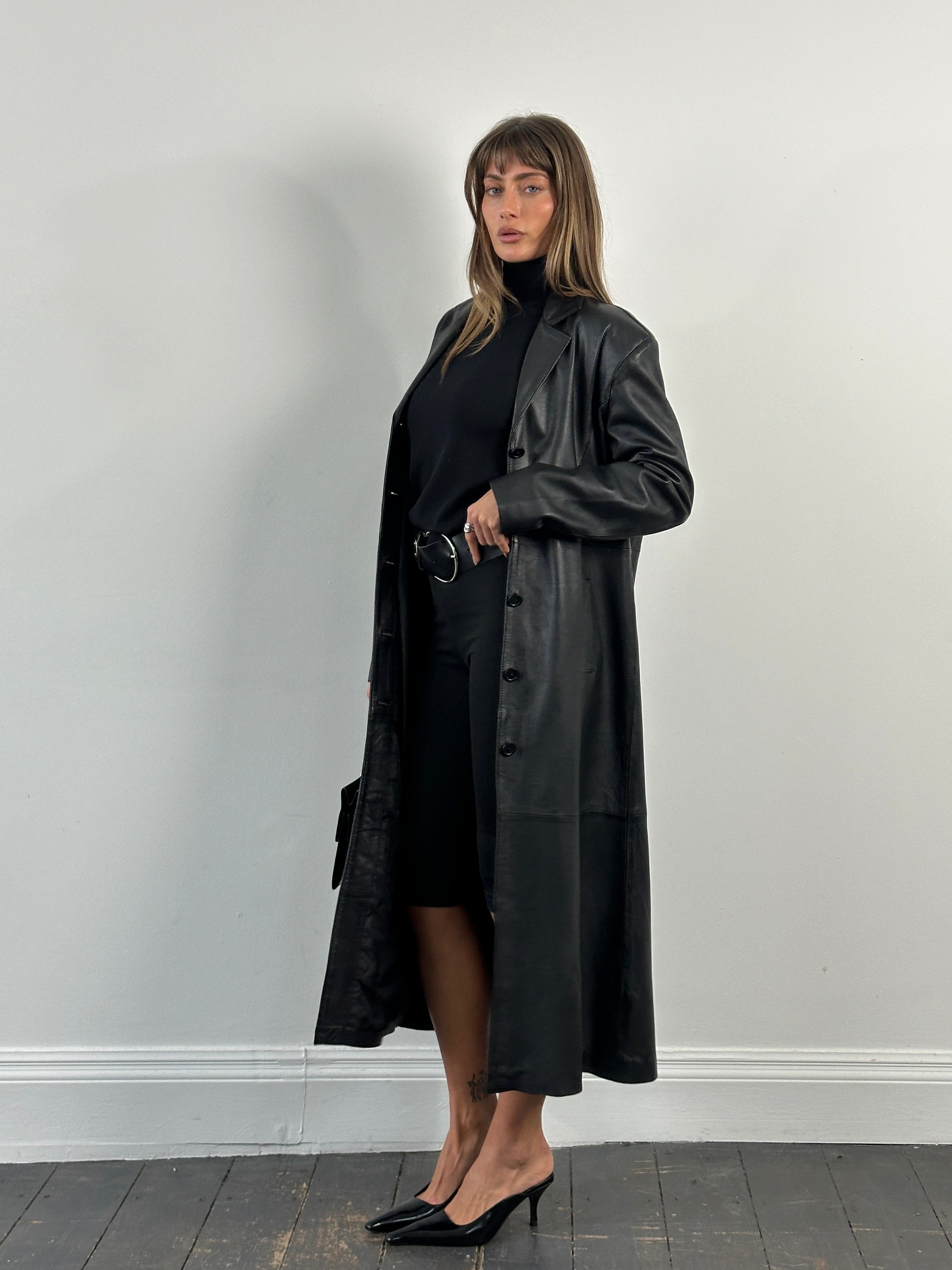Vintage 1990s leather trench coat, floor length, with classic design and leather texture, in size large.