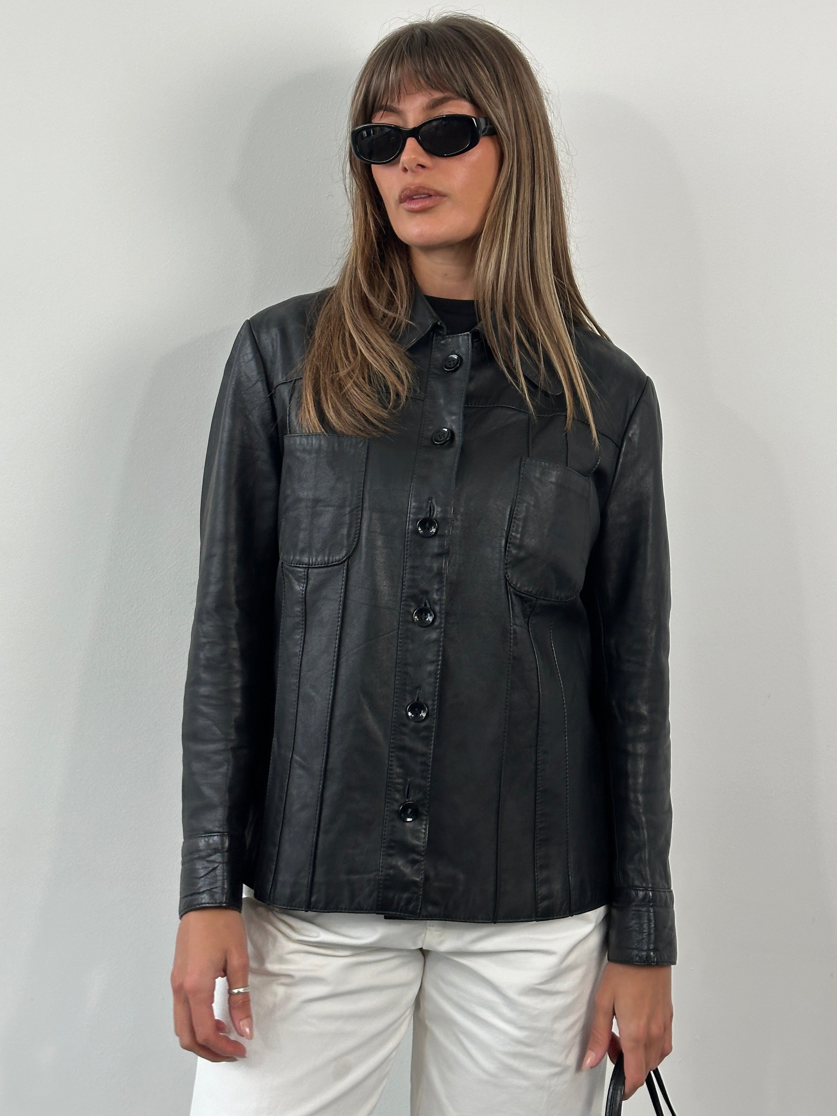 Vintage 1990s Dagger Collar leather jacket in medium size, featuring classic black leather and unique dagger collar design.