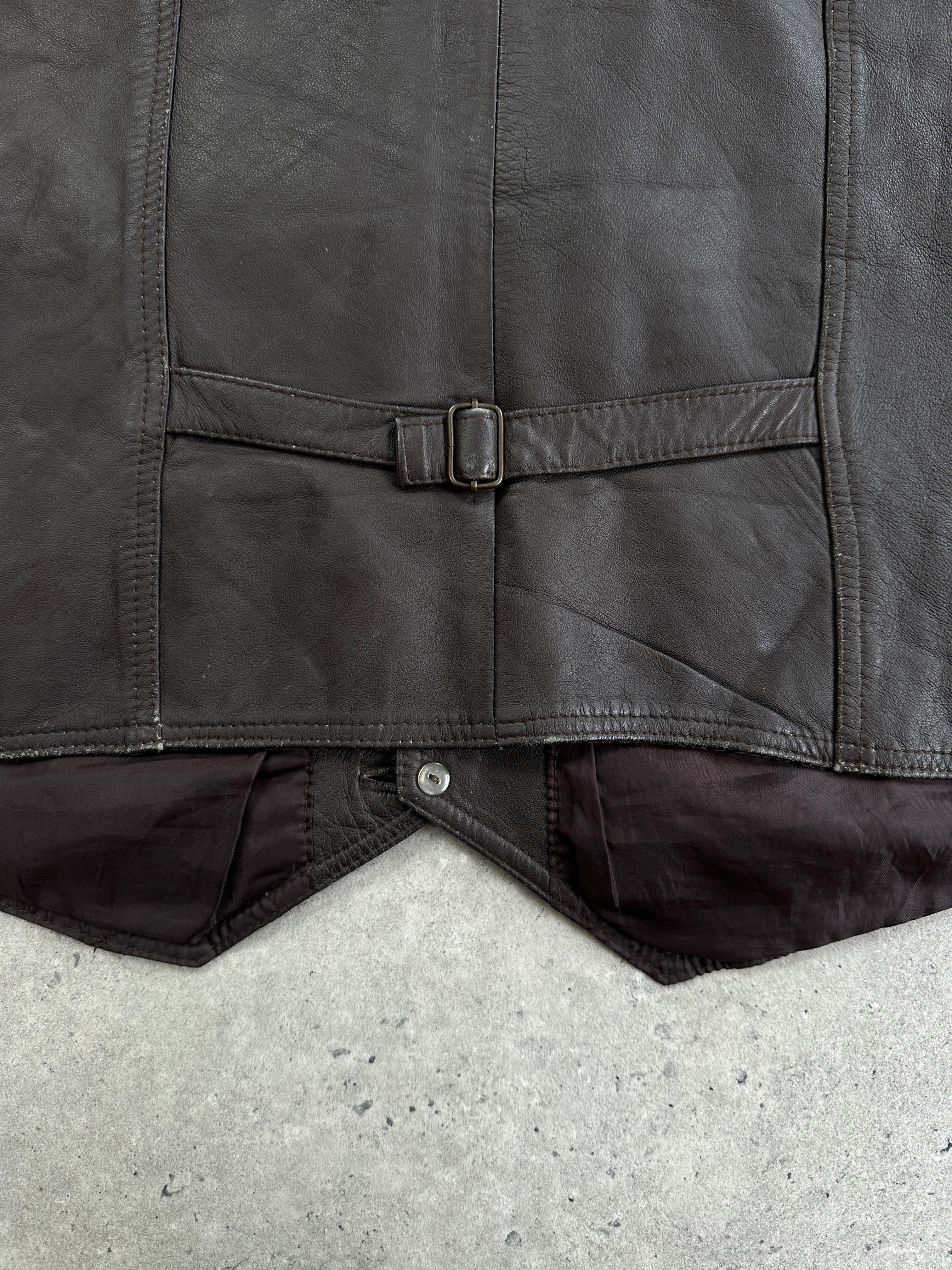 Vintage 1990s leather waistcoat in XL size, featuring classic design and rich brown leather, displayed on a hanger.