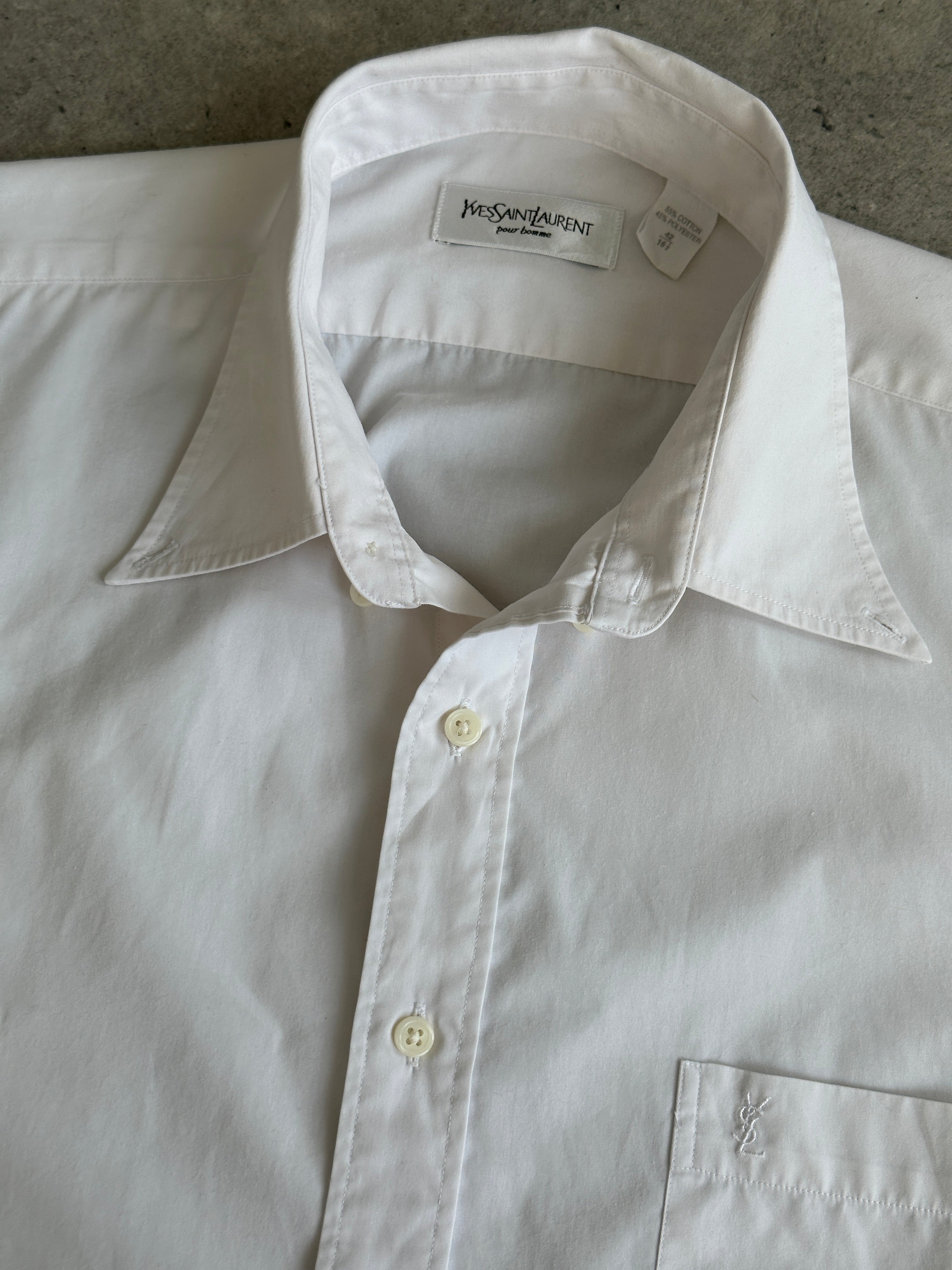 Yves Saint Laurent 2000s cotton sleeveless logo shirt in size L, featuring the iconic YSL branding and a classic sleeveless design.