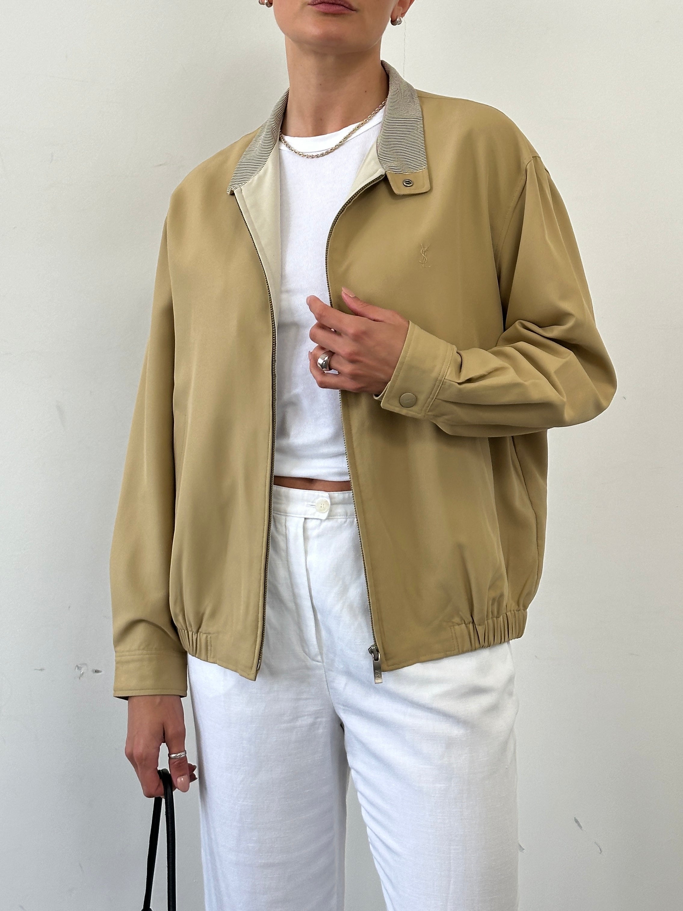 Yves Saint Laurent logo bomber jacket in black, front view showing the brand's signature design and stylish fit.