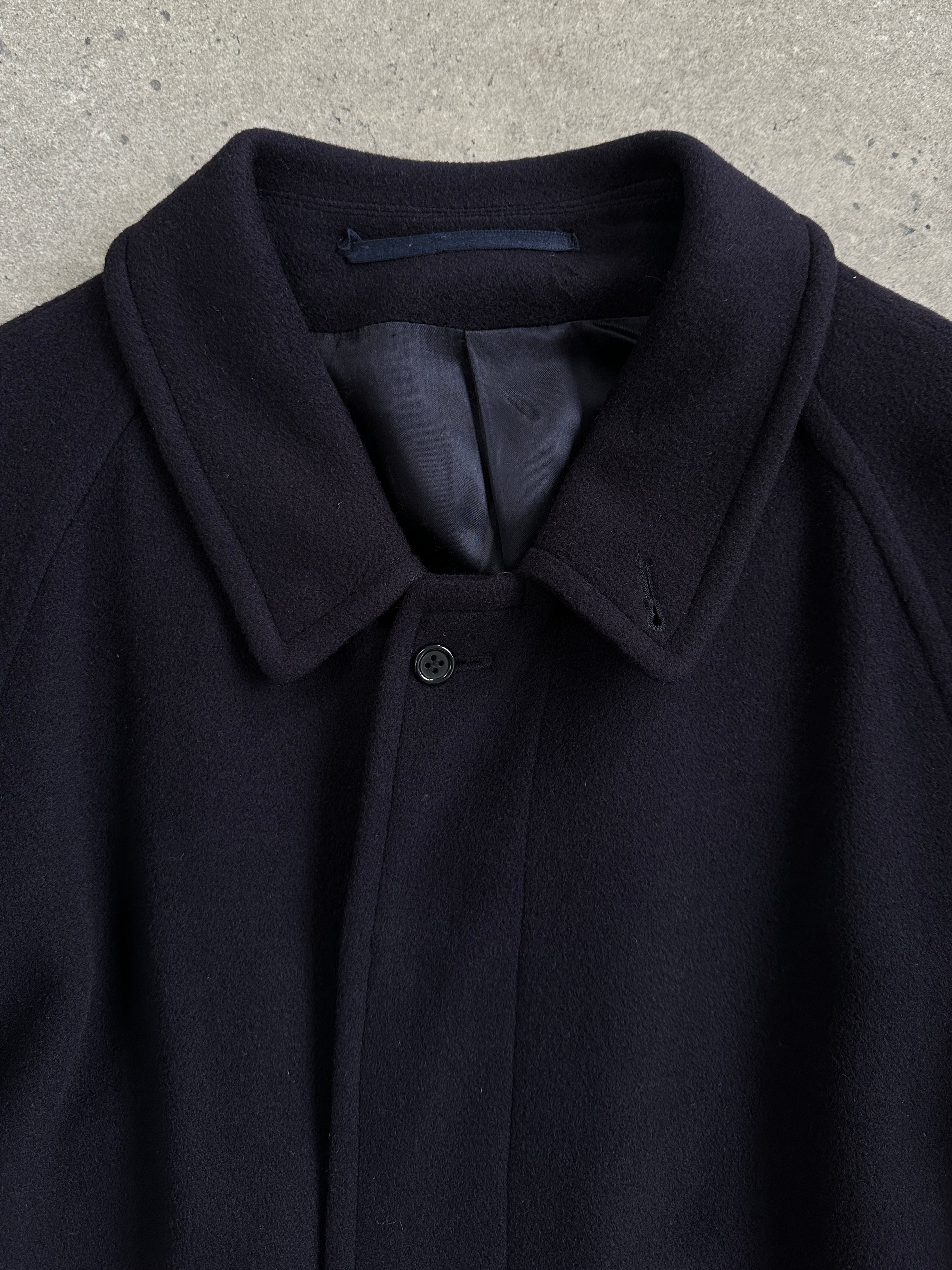 Elegant Jaeger 1990s high neck pure cashmere coat in XL, shown hanging with a classic design and soft wool texture.