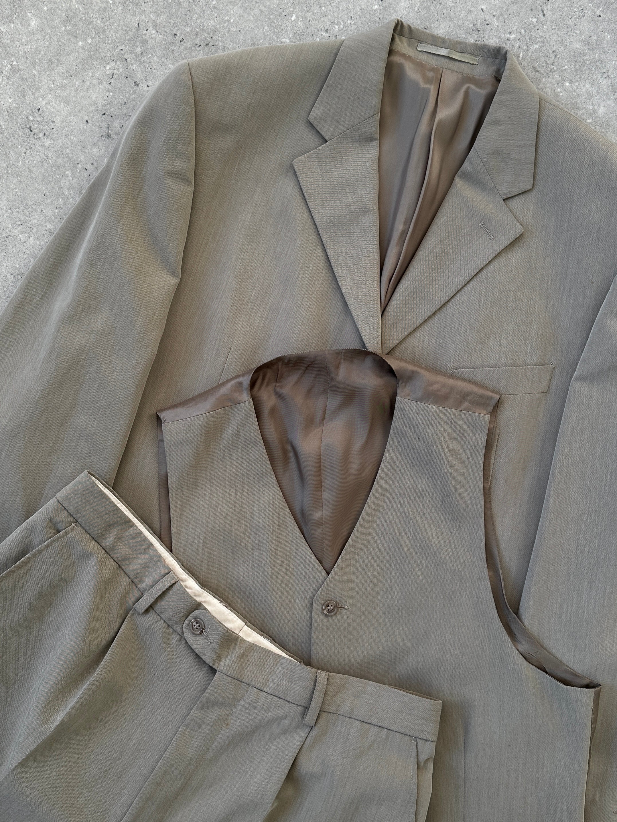 Pierre Cardin three-piece suit in size 44R/W34, featuring a tailored jacket, vest, and trousers, displayed on a hanger.