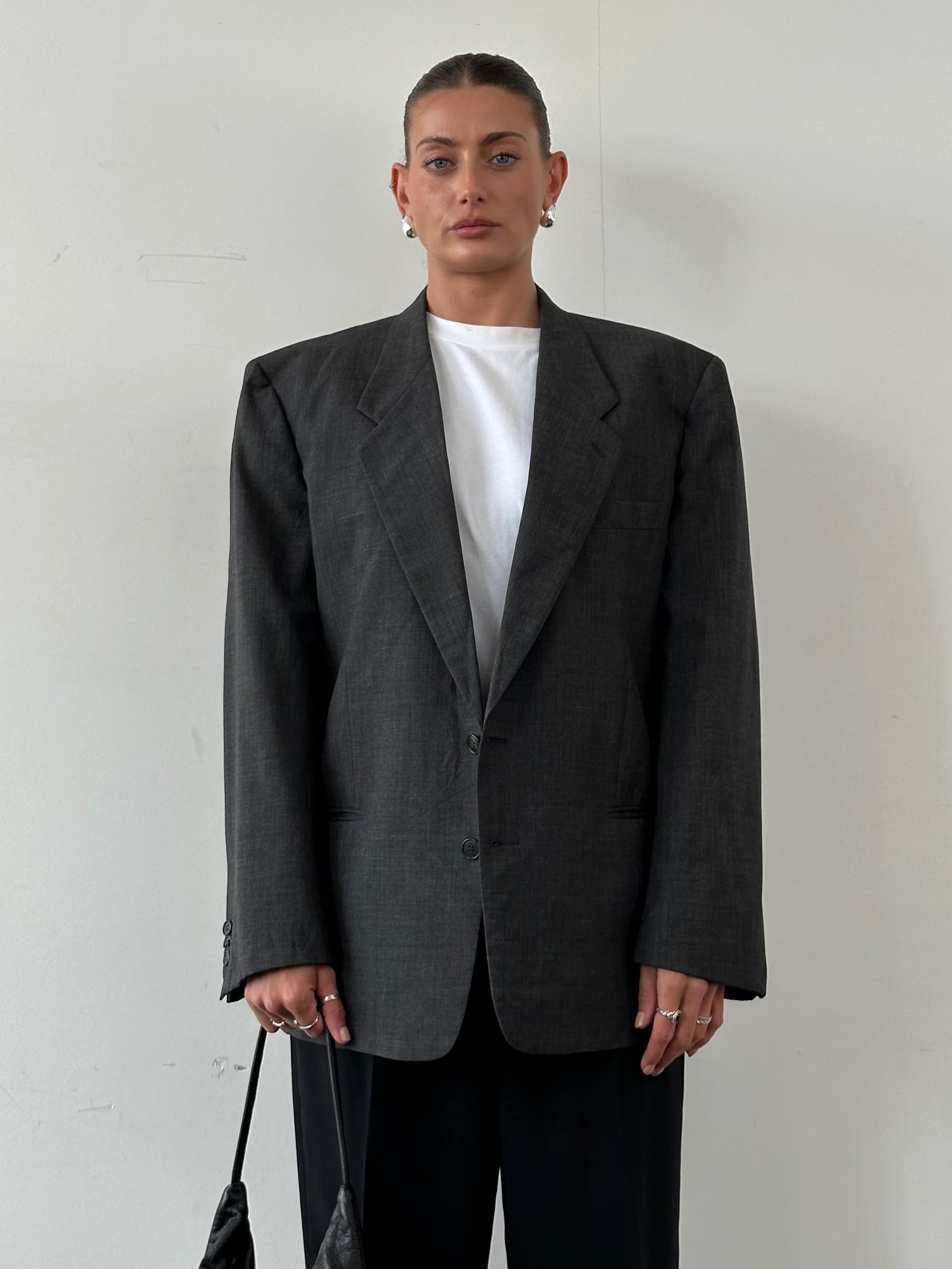 Giorgio Armani pure wool single-breasted blazer in size 42R/XL, tailored fit with classic lapel and button closure.