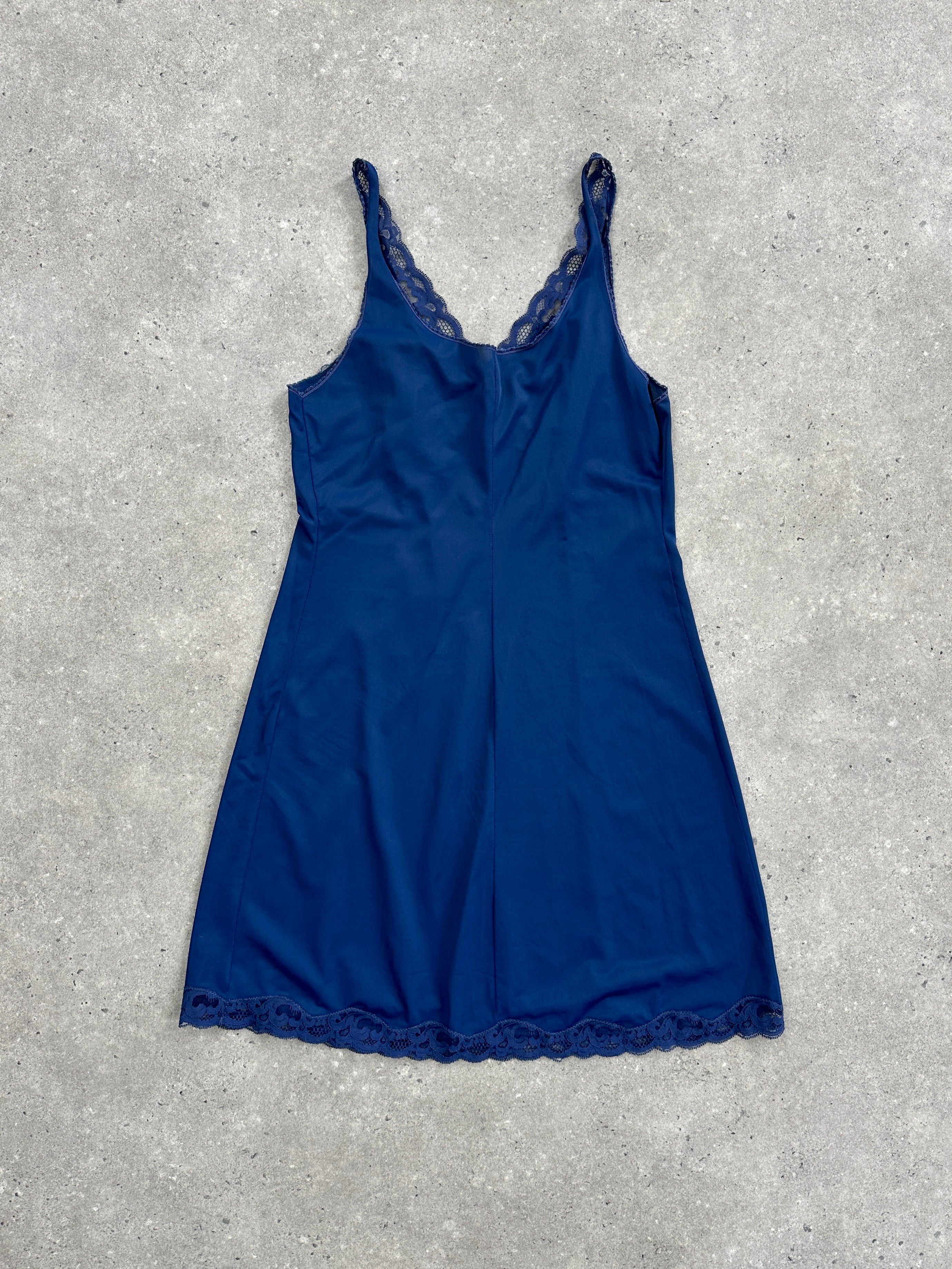 Vintage 1980s lace sheer mini slip dress in size small, featuring delicate lace details and a vintage-inspired design.