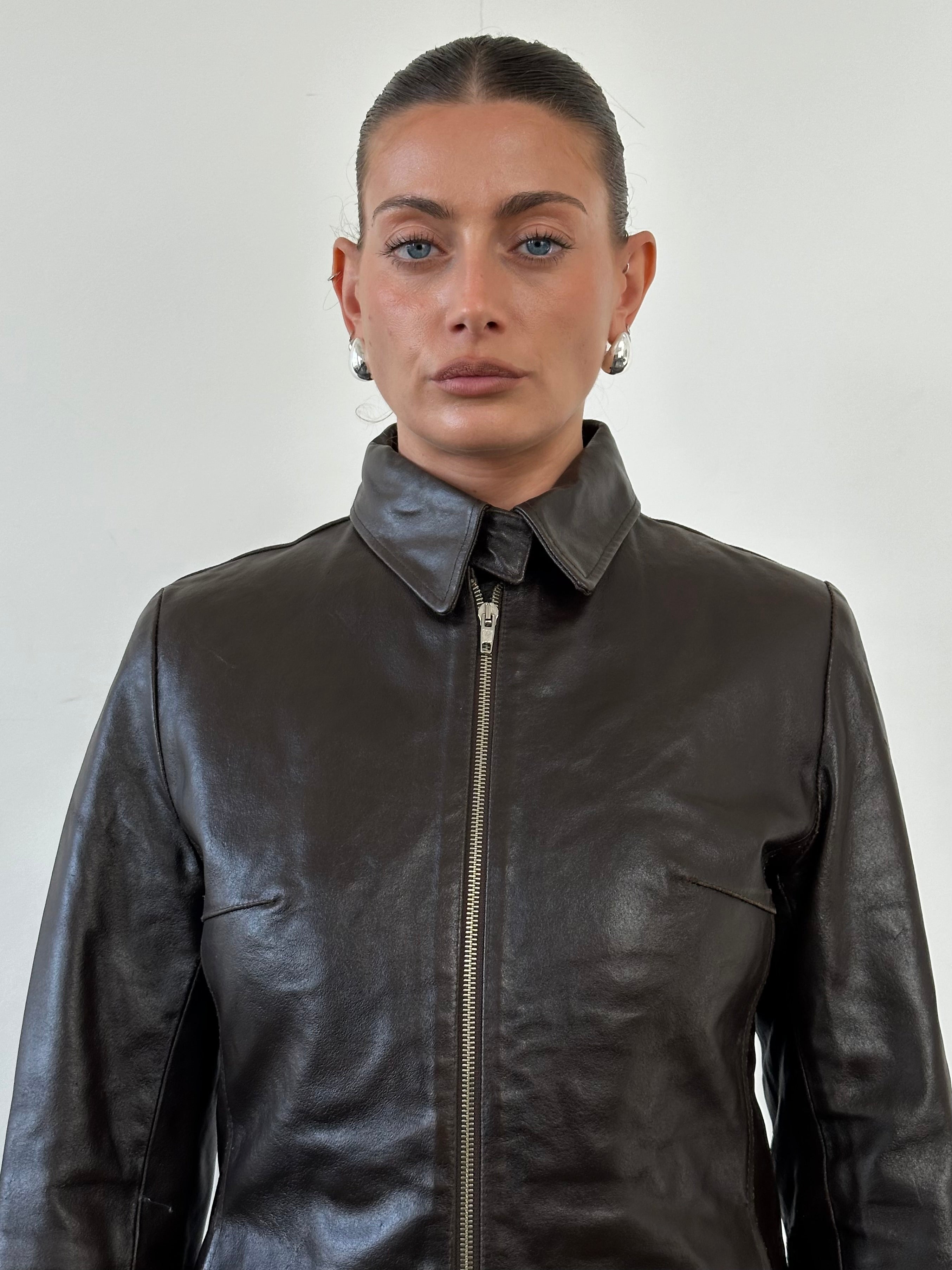 Vintage smooth leather jacket in size S, showcasing classic design and durable leather material.