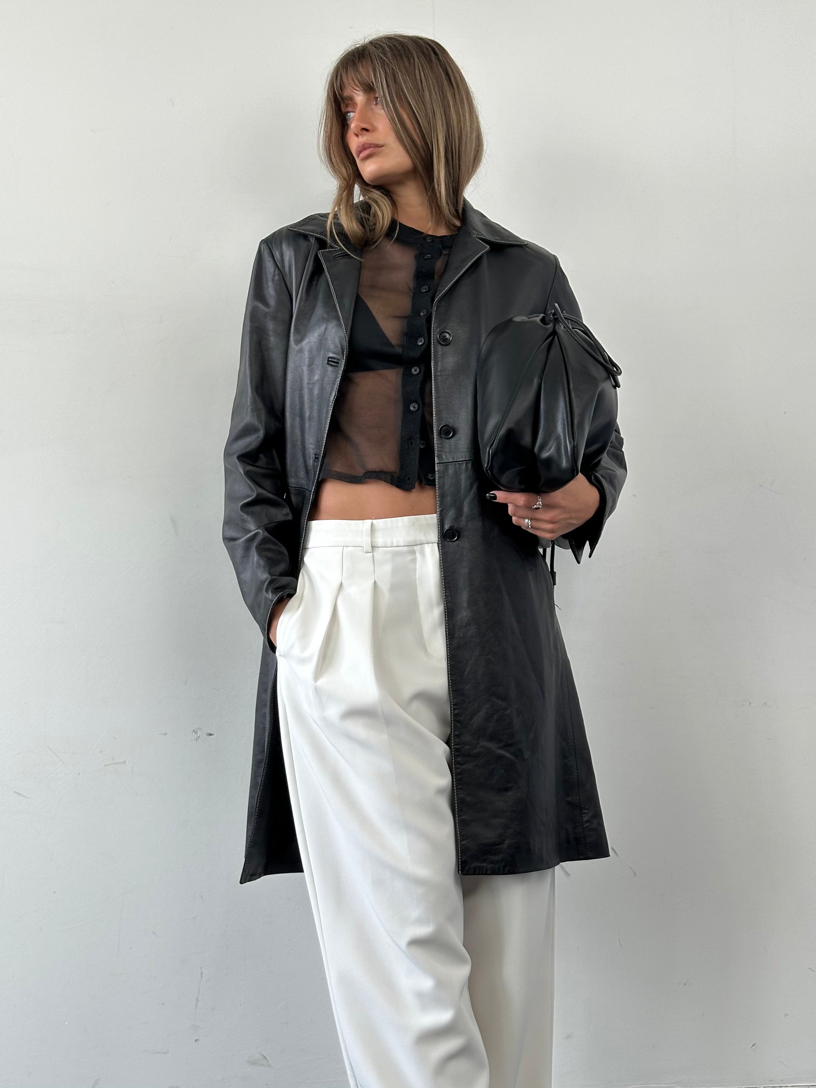 Conbipel contrast stitch leather trench coat in black and tan, featuring a tailored fit and stylish design.