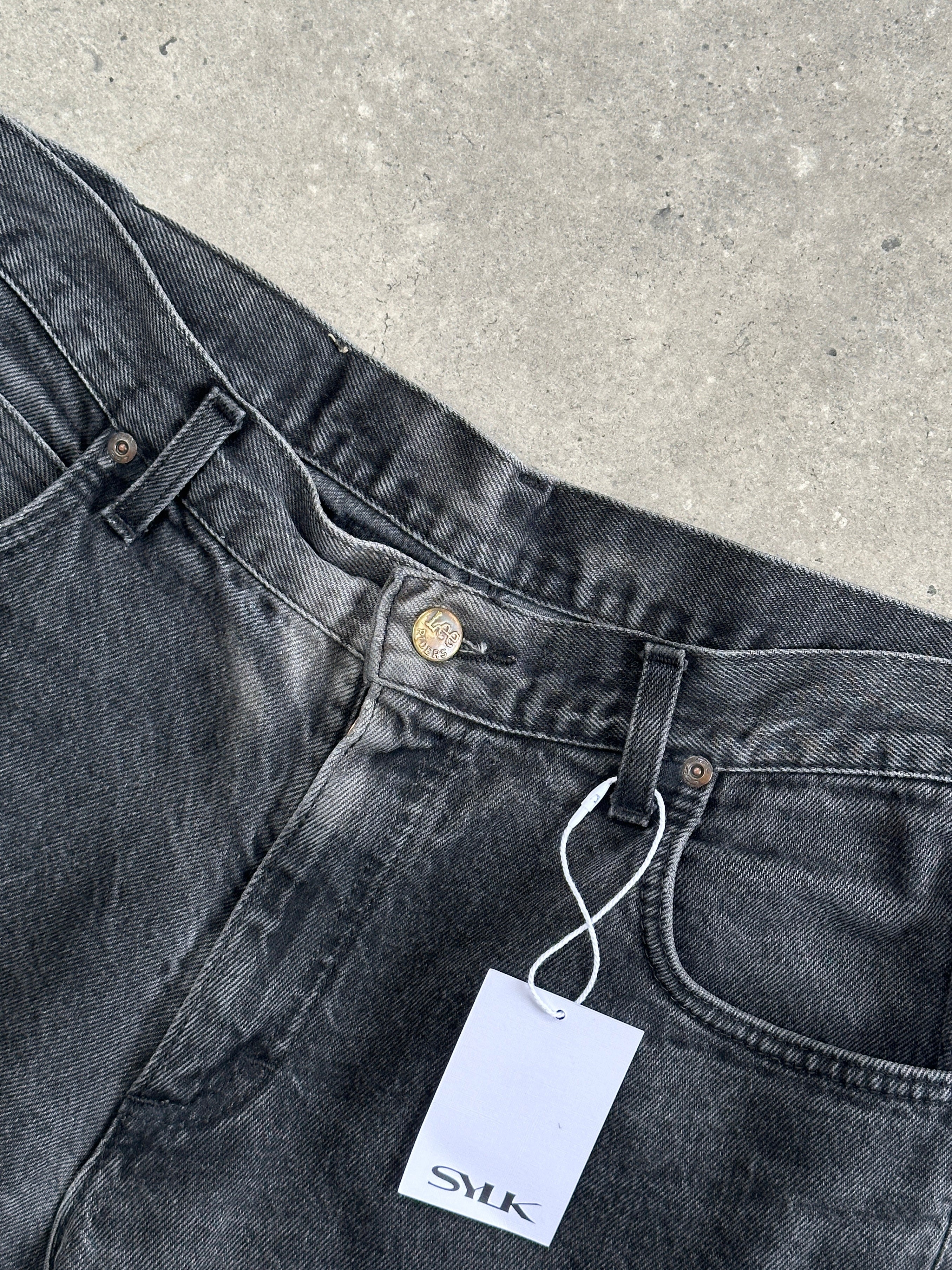 Lee high waisted straight leg denim jeans in W32, showing classic blue cotton jeans with front pockets and belt loops.