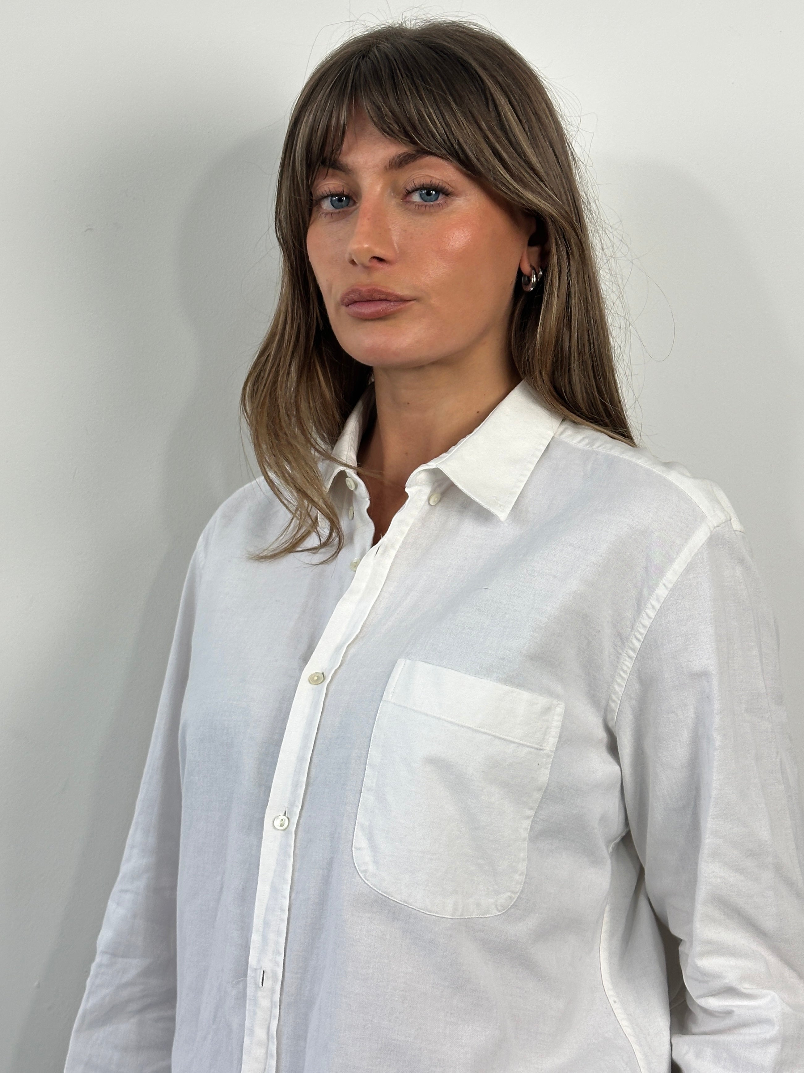 Yves Saint Laurent 1990s pure cotton shirt in size L, showcasing a classic, crisp button-up design with a folded collar.