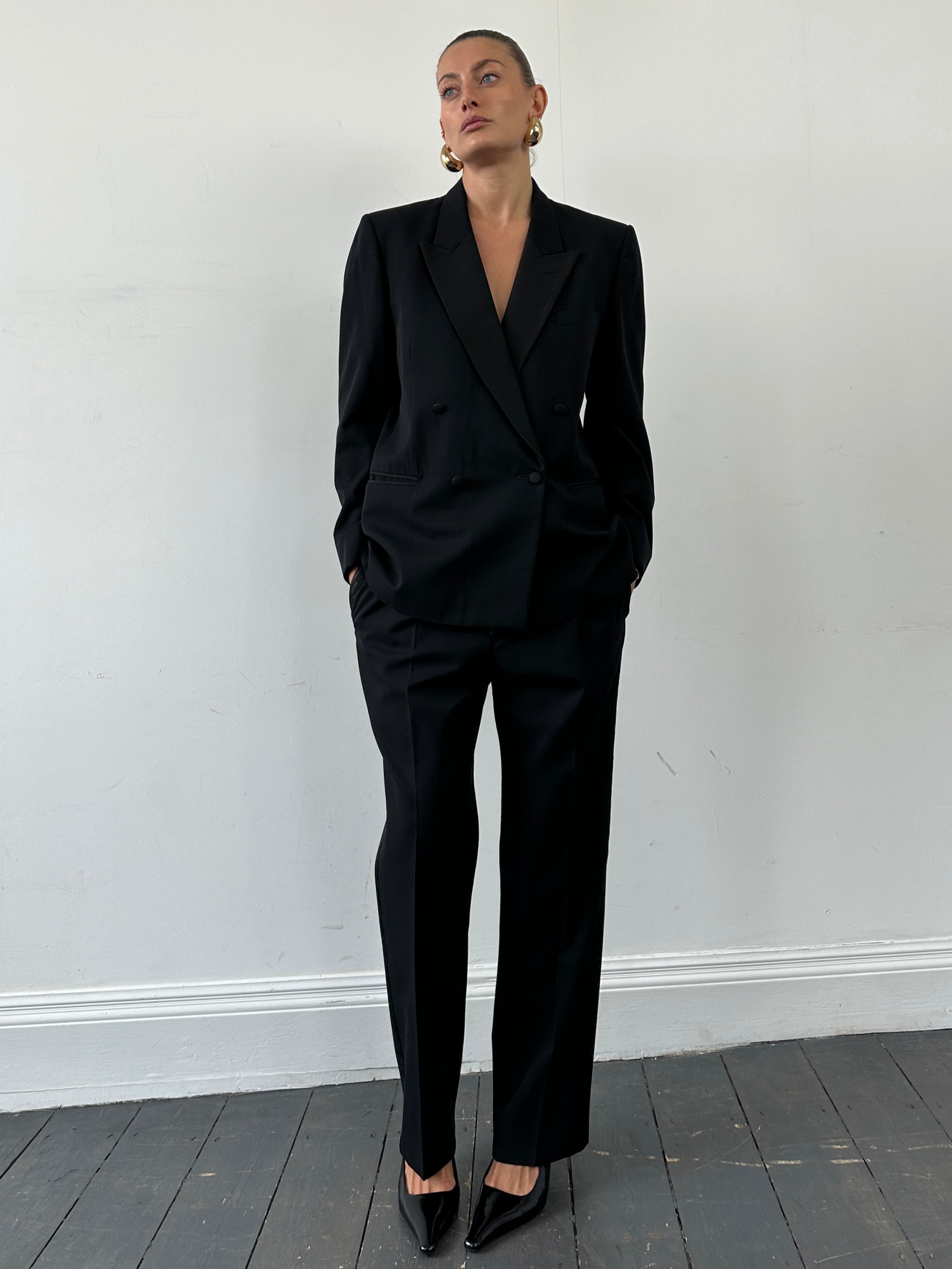 Christian Dior Monsieur tuxedo jumpsuit, double-breasted design in size 42S/W34, tailored fit, sleek black fabric with lapels.