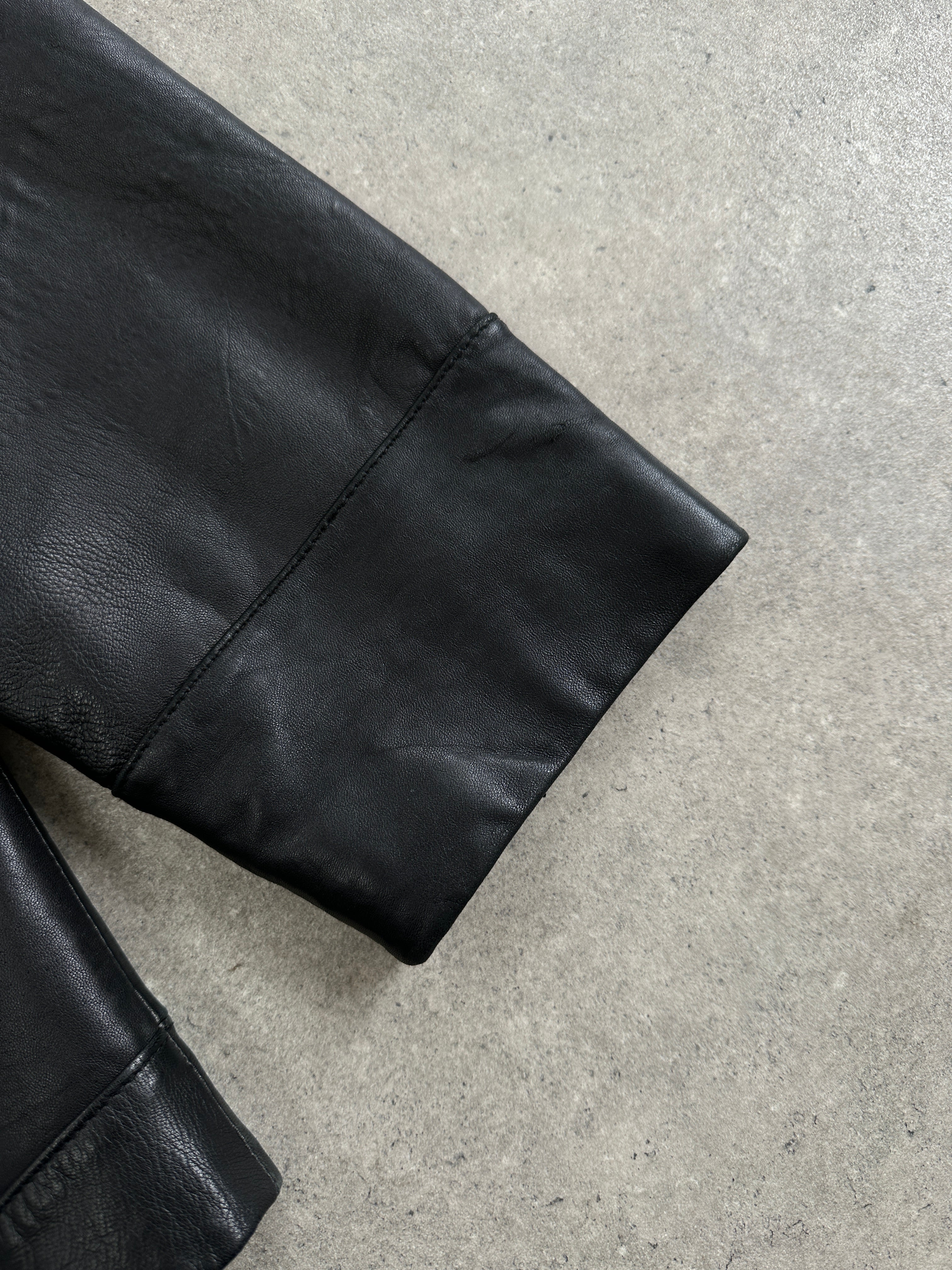Balmain smooth leather jacket in XL size, black, with sleek design and classic collar, displayed on a hanger.