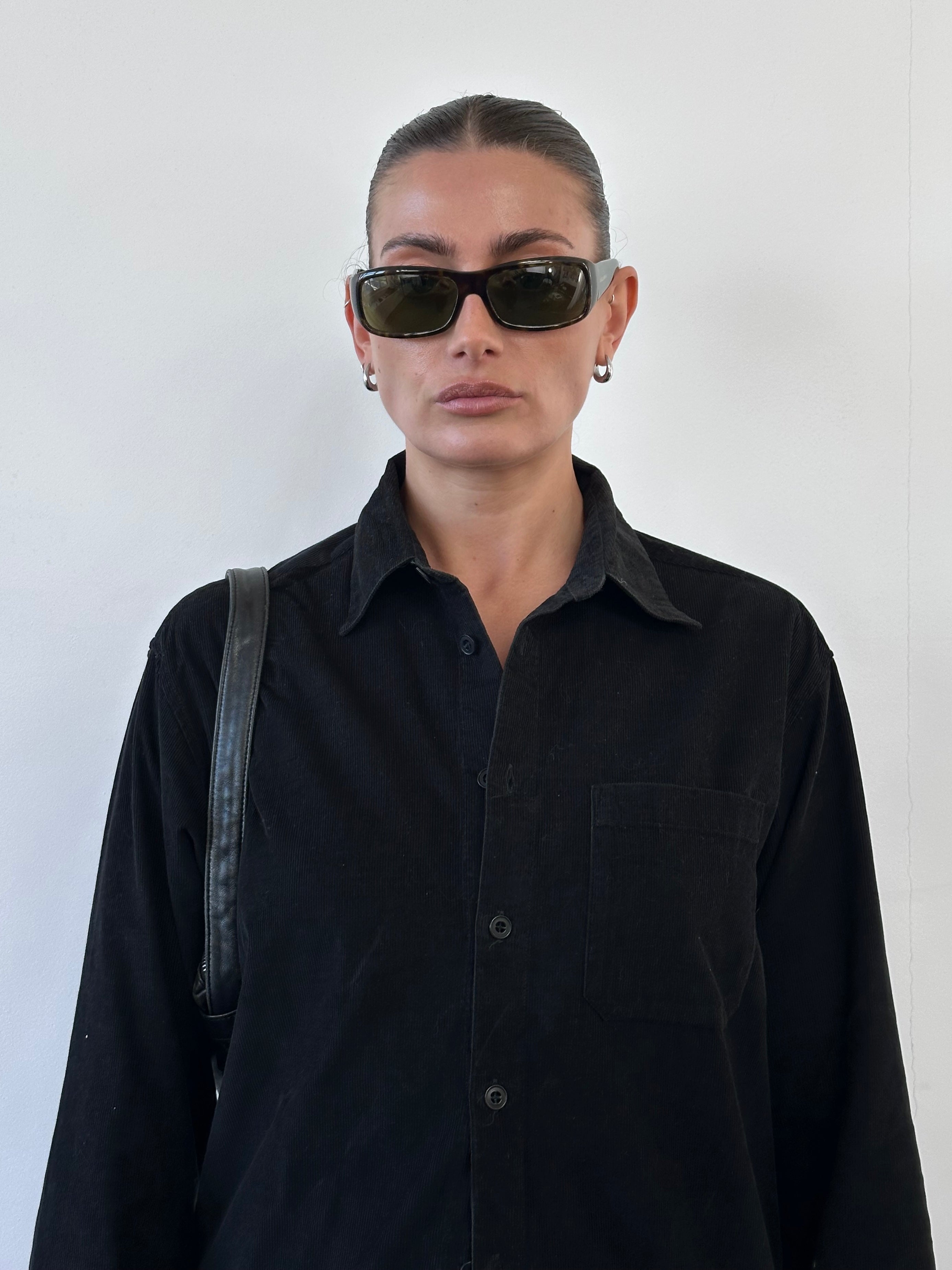 Versace Versus 00s corduroy zip shirt in size S, featuring a stylish collar and front zipper, displayed on a hanger.