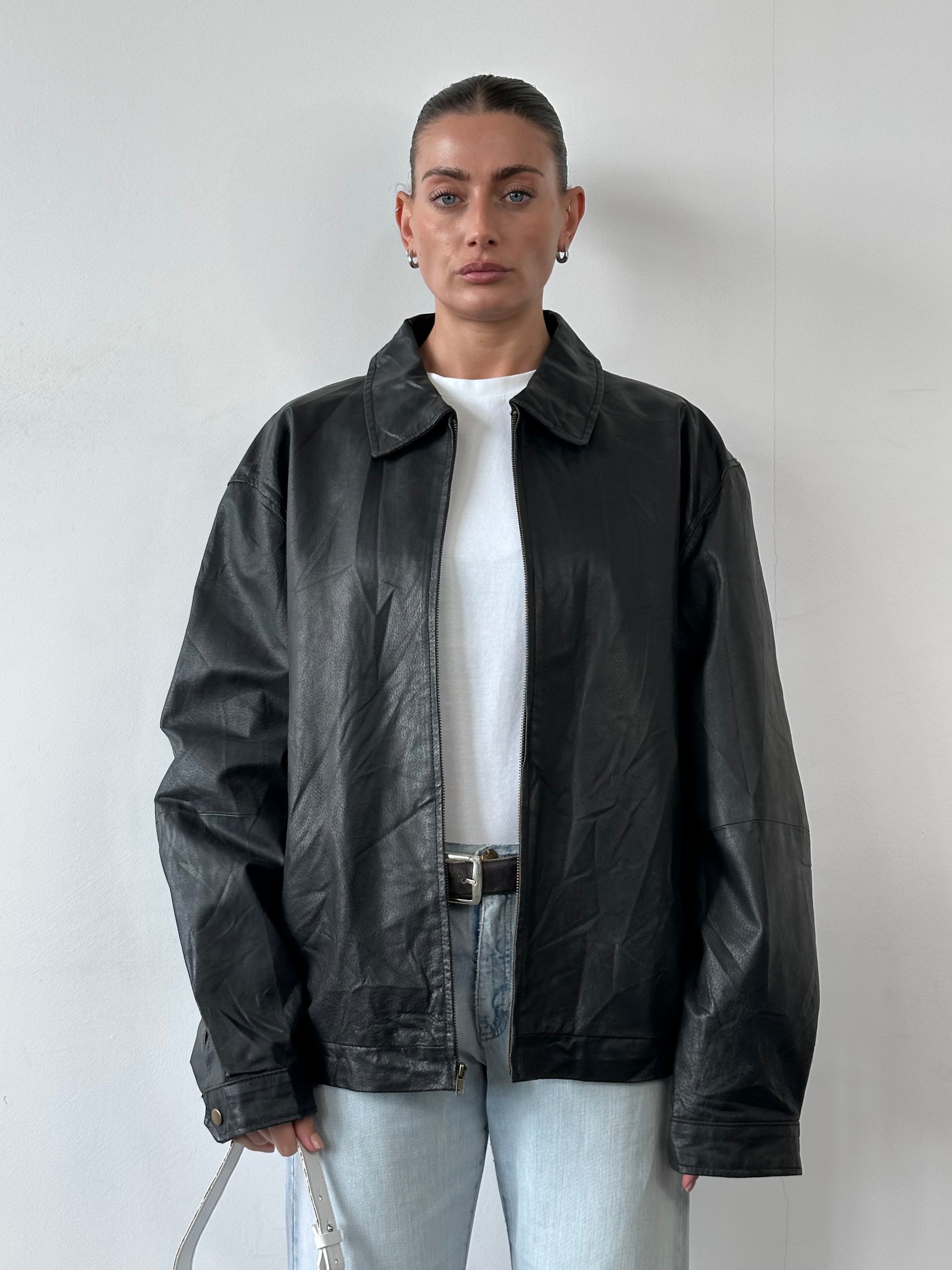 Vintage Leather Minimal Bomber Jacket in XL, showcasing sleek design and classic style with smooth leather material.