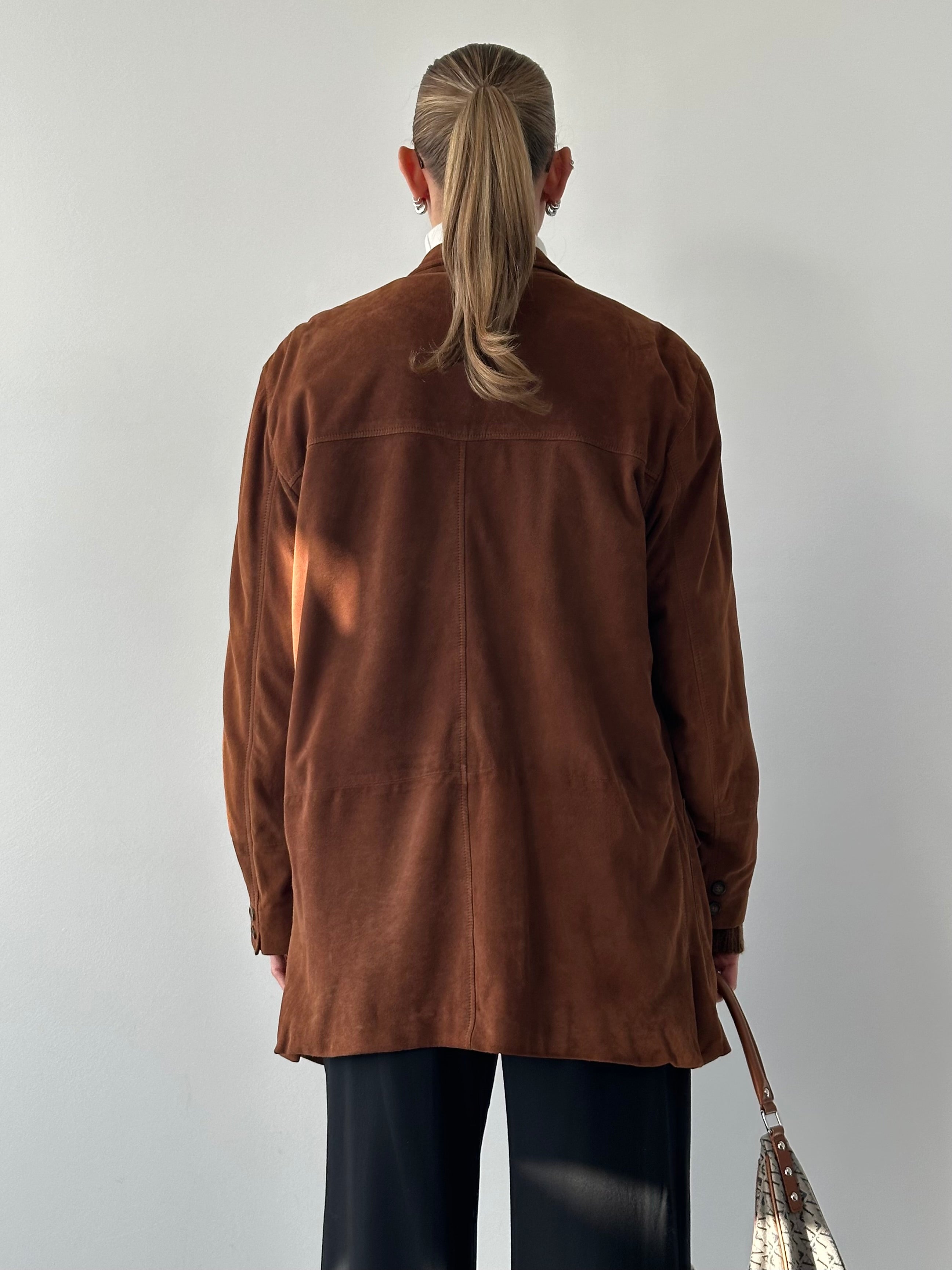 Vintage relaxed suede blazer in XL, showing the soft leather texture and classic tailored fit on a hanger.