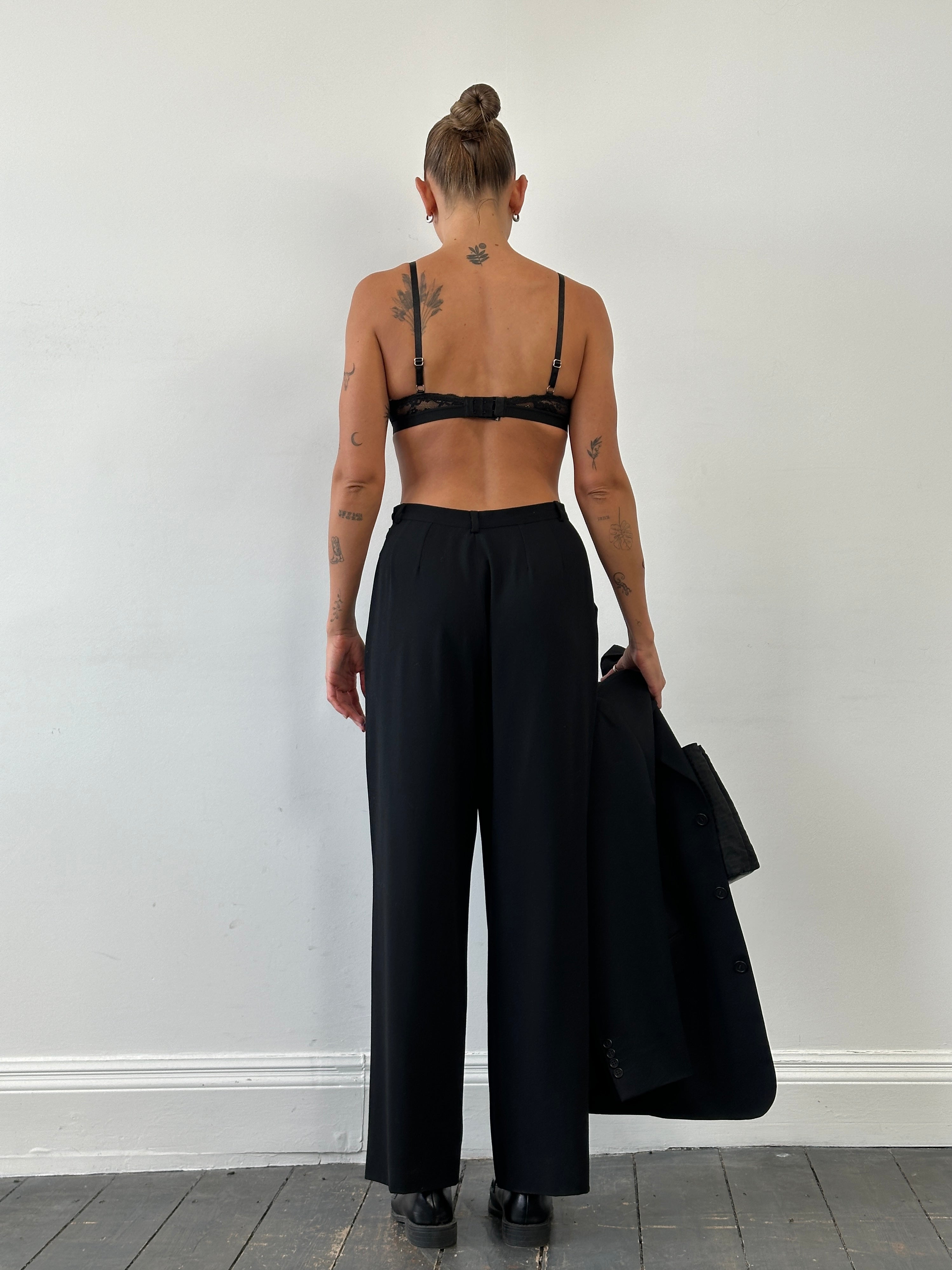 Giorgio Armani 1990s wool wide-leg pleated tailored trousers in size W26, shown on a hanger with a neutral background.