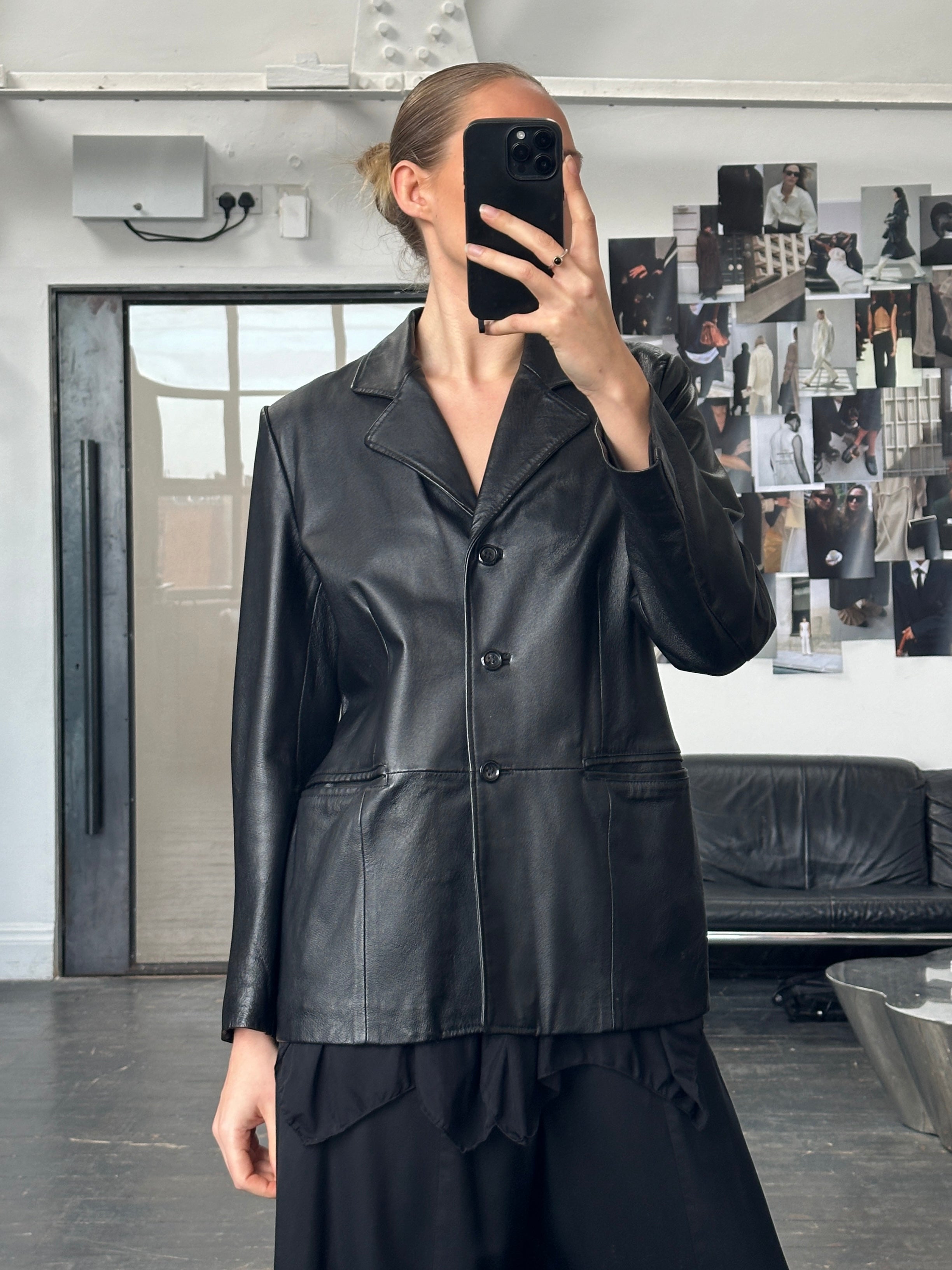Vintage 1990s minimalist leather jacket in size M, featuring clean design and classic black leather from the Vintage brand.