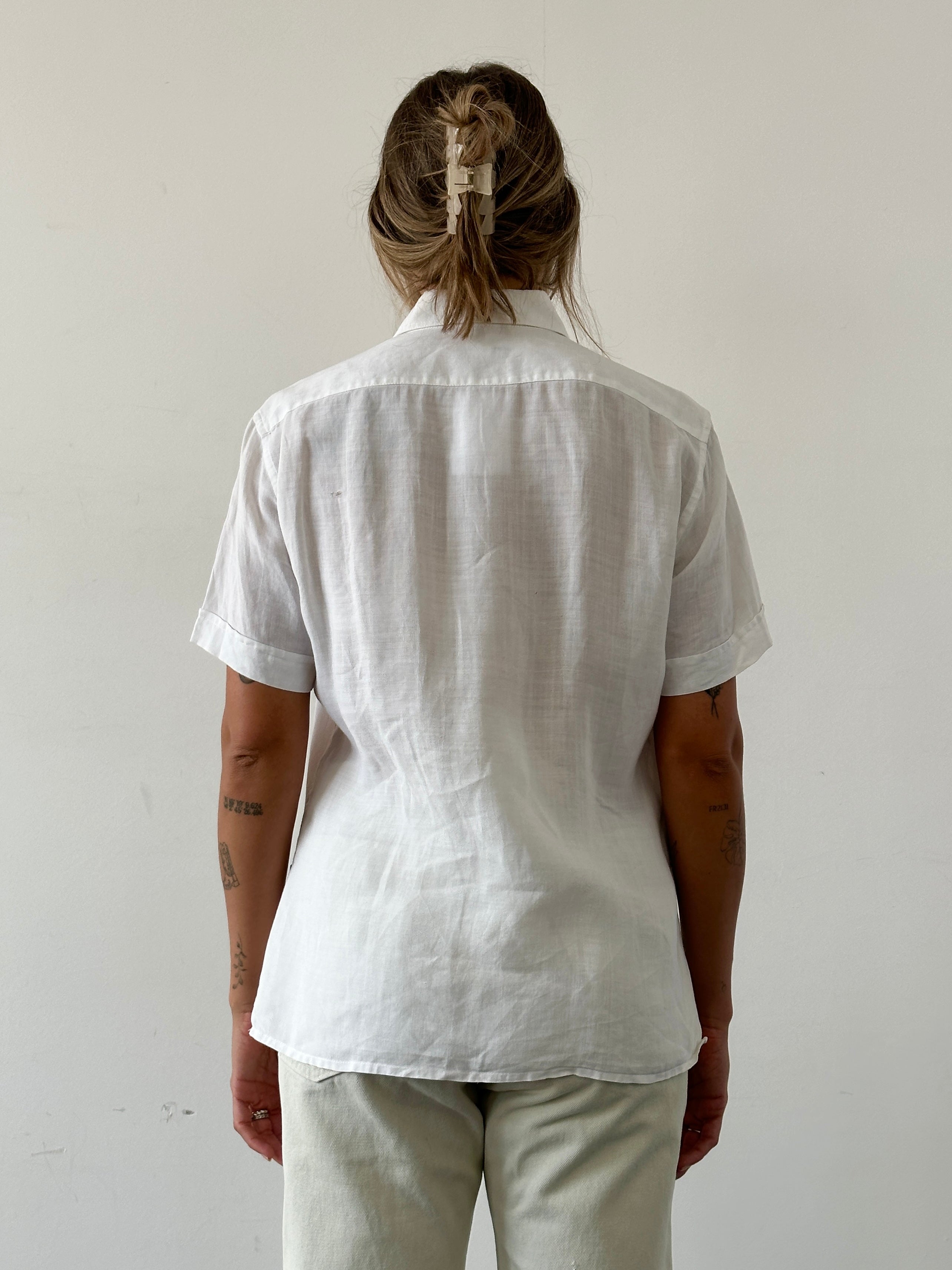 Guess pure linen sheer short sleeve shirt in white, lightweight and breathable, displayed on a hanger.