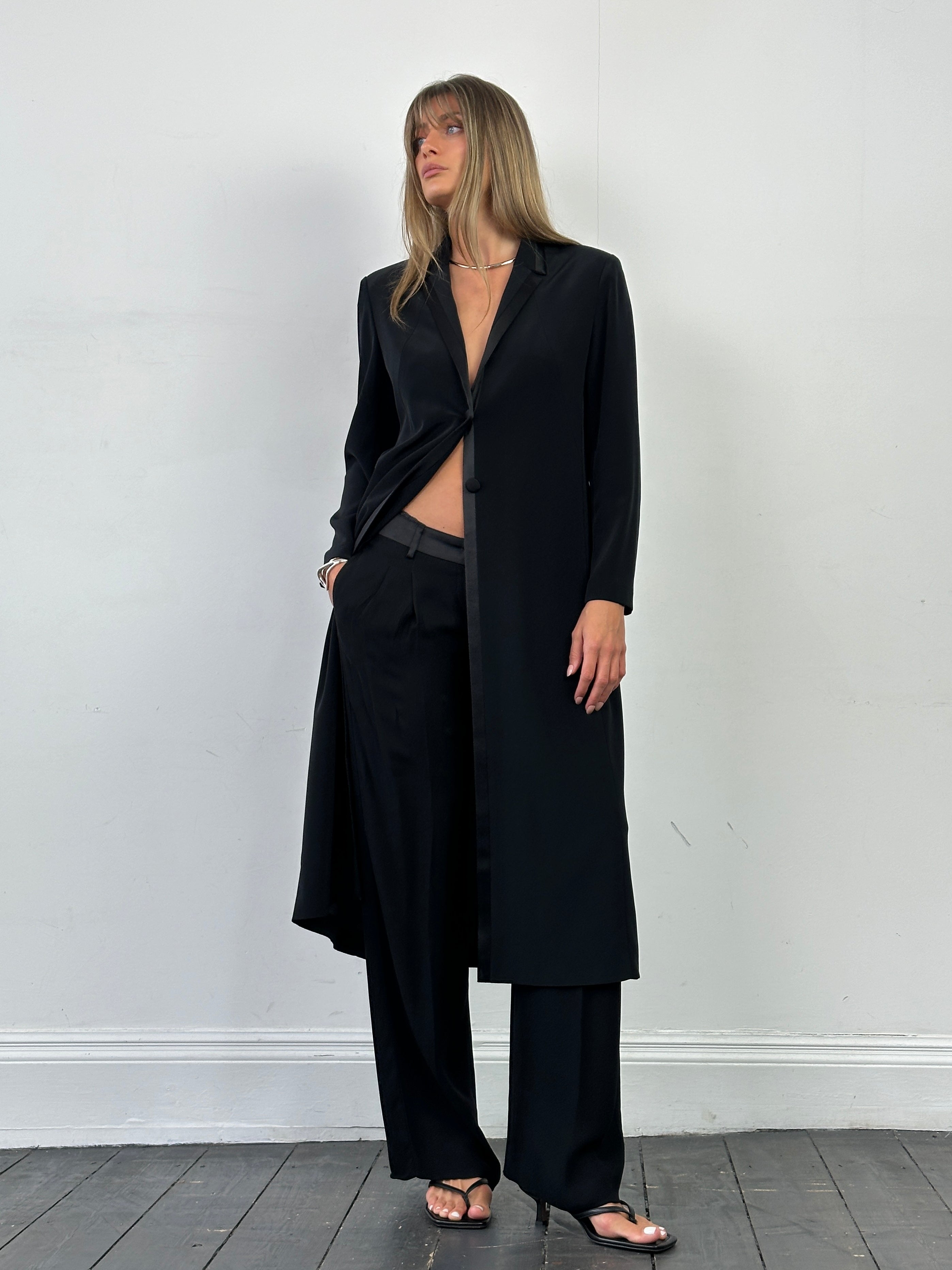 Vintage lightweight tuxedo coat in size small, tailored fit, classic black formal coat with satin lapels for elegant occasions.