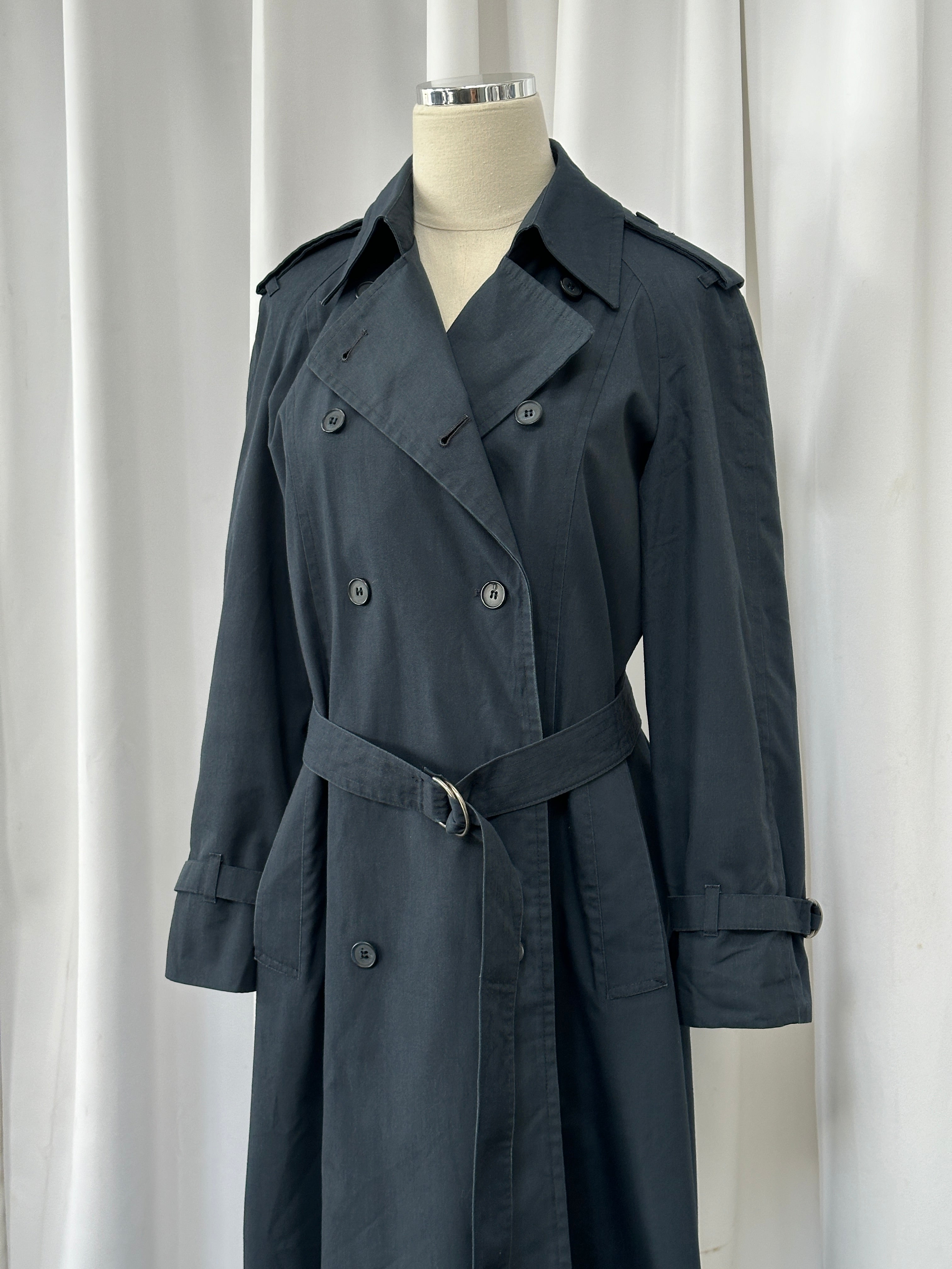 London Fog 1980s double-breasted cotton trench coat in size S, shown hanging with classic collar and belted waist.