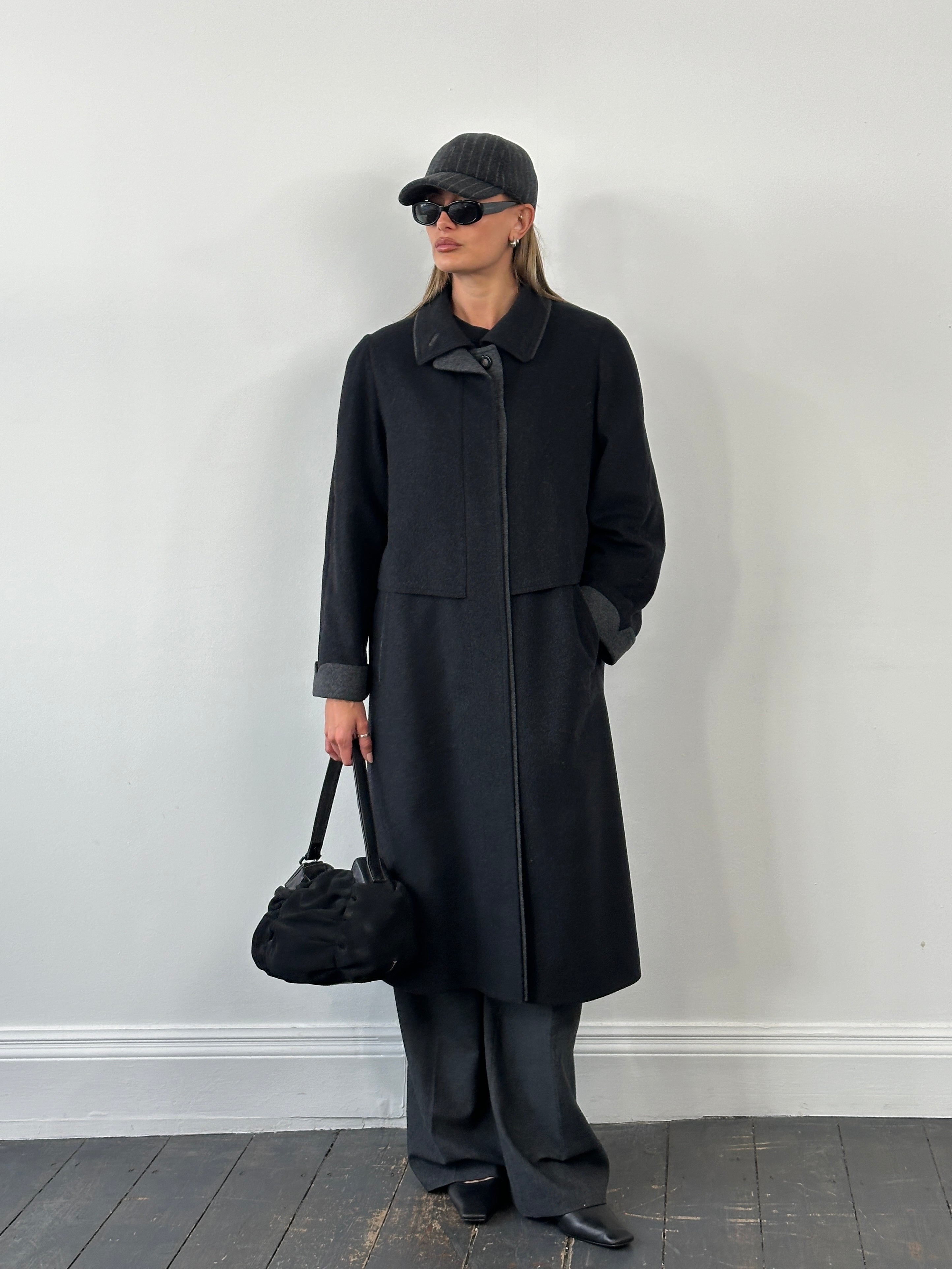 Vintage 1990s wool coat with concealed placket, in size large, featuring classic design and textured fabric.