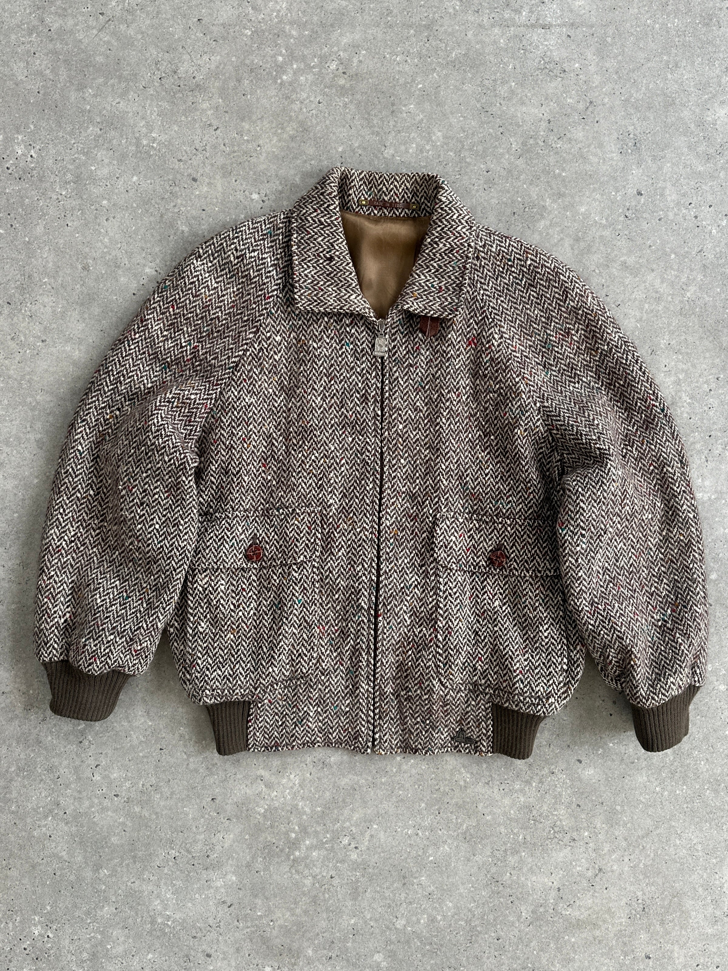 Vintage pure wool herringbone bomber jacket in size large, featuring classic pattern and tailored fit.