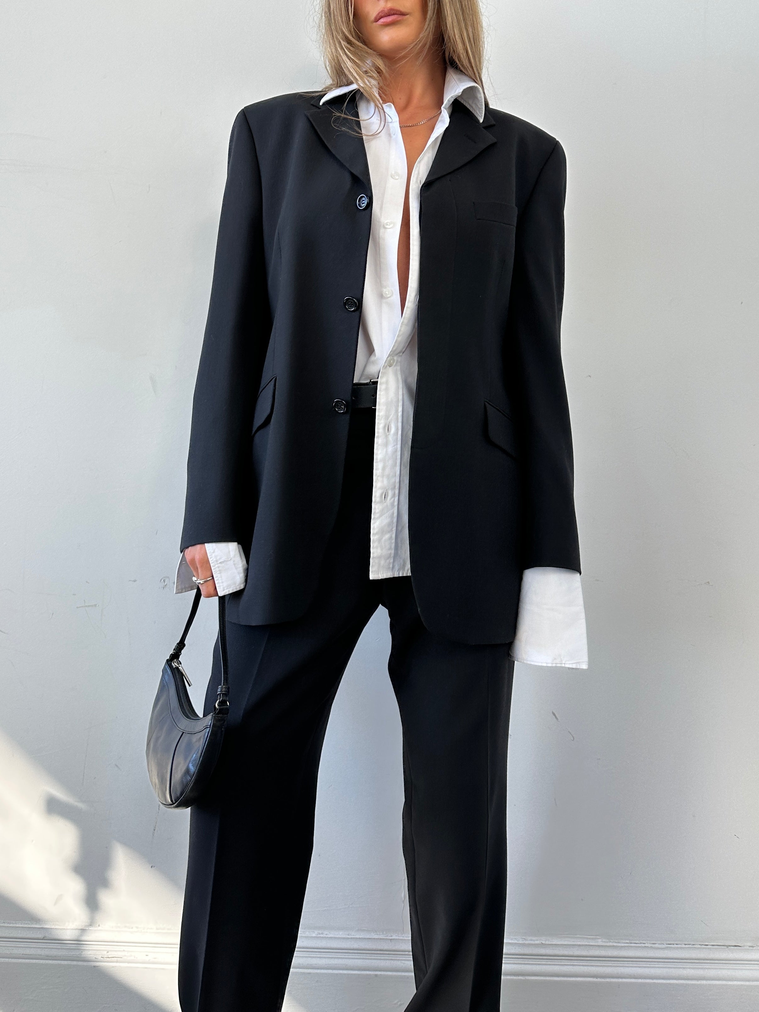 Vintage relaxed jumpsuit with concealed placket, in size 40R/L, featuring a vintage-inspired design and comfortable fit.
