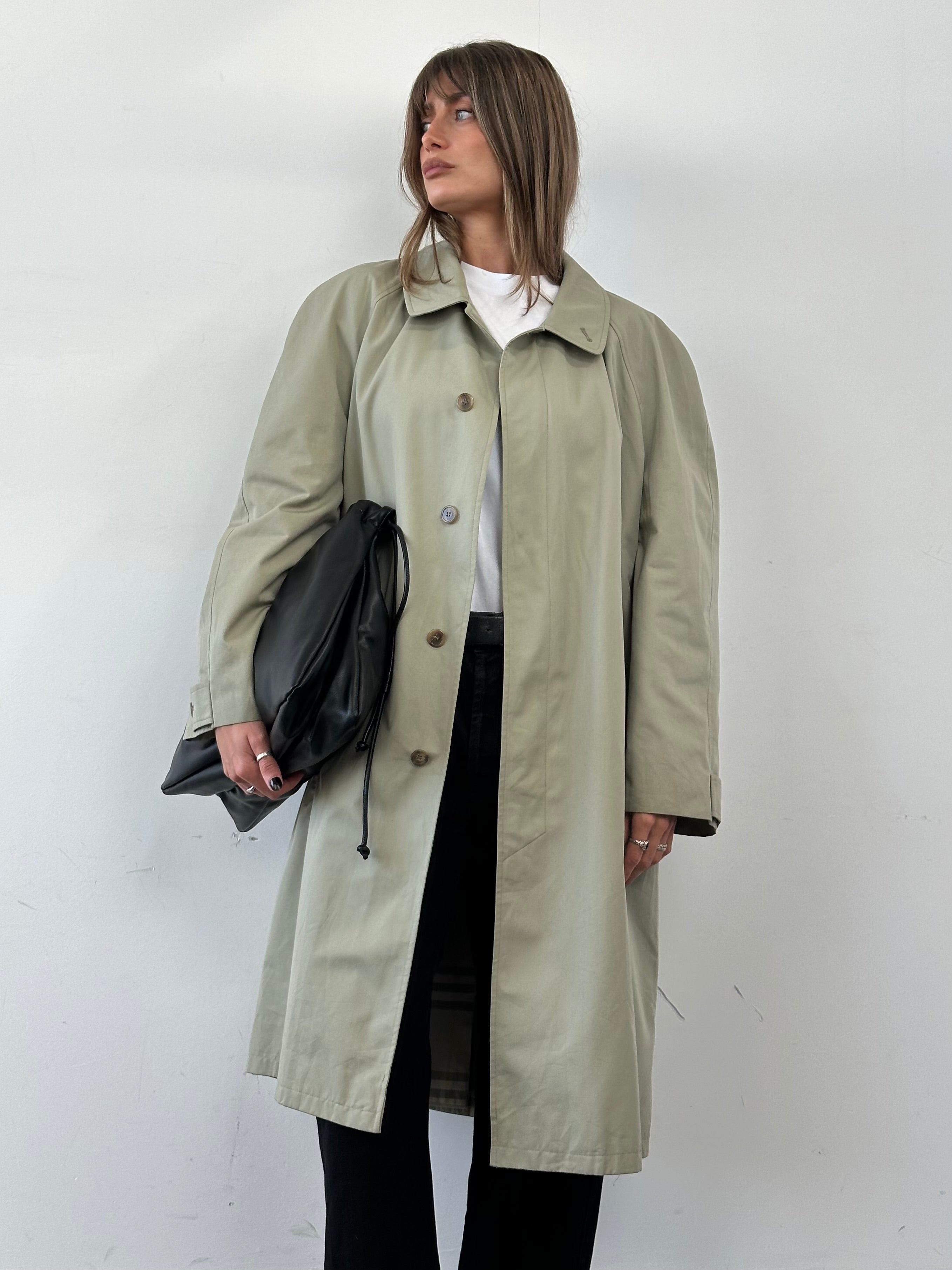 Yves Saint Laurent concealed placket trench coat in XXL, beige color, classic design with collar and button details.