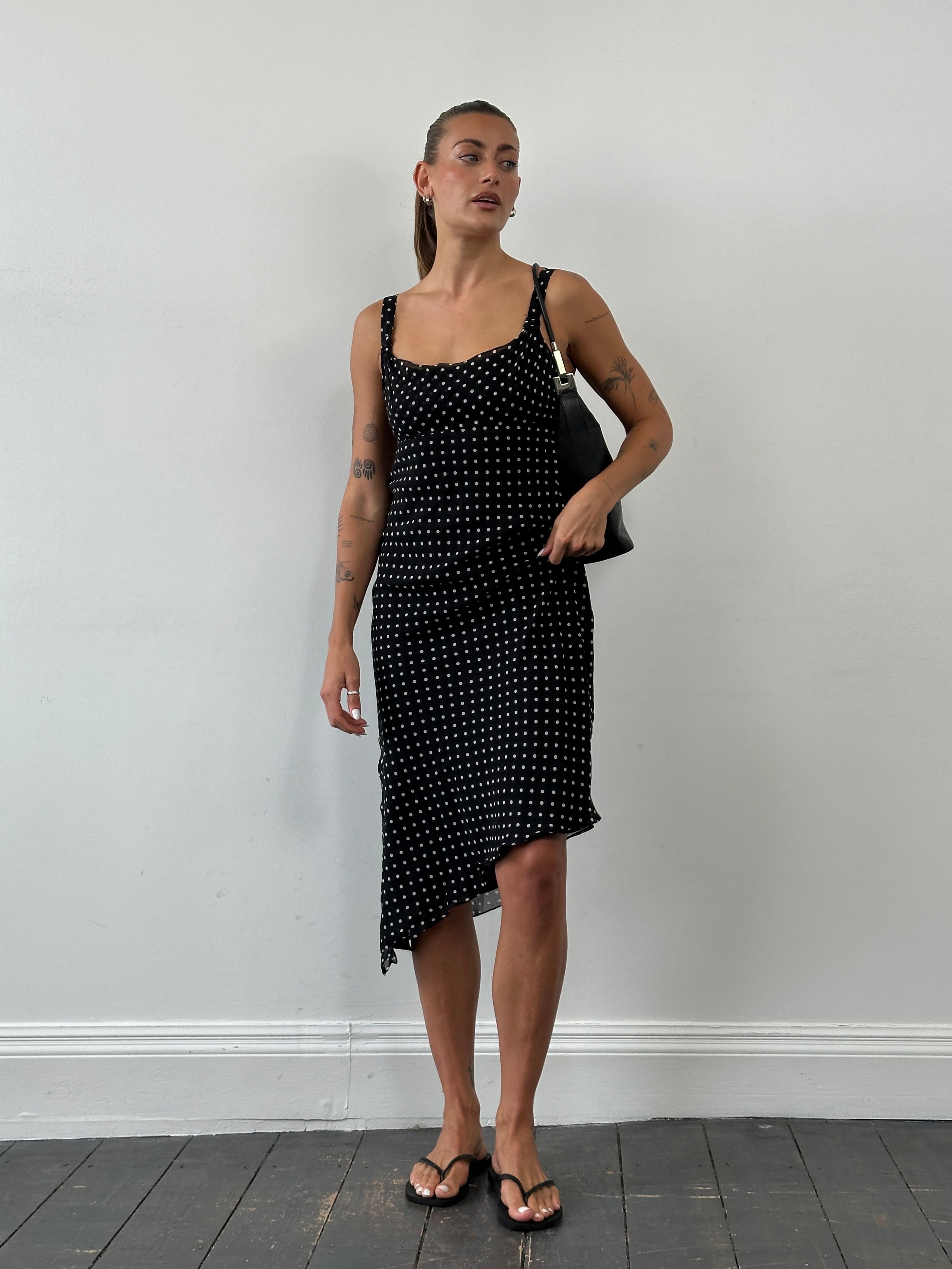 Max Mara Pianoforte 1990s pure silk polka dot asymmetric midi dress worn by a model, featuring a stylish, vintage-inspired design.