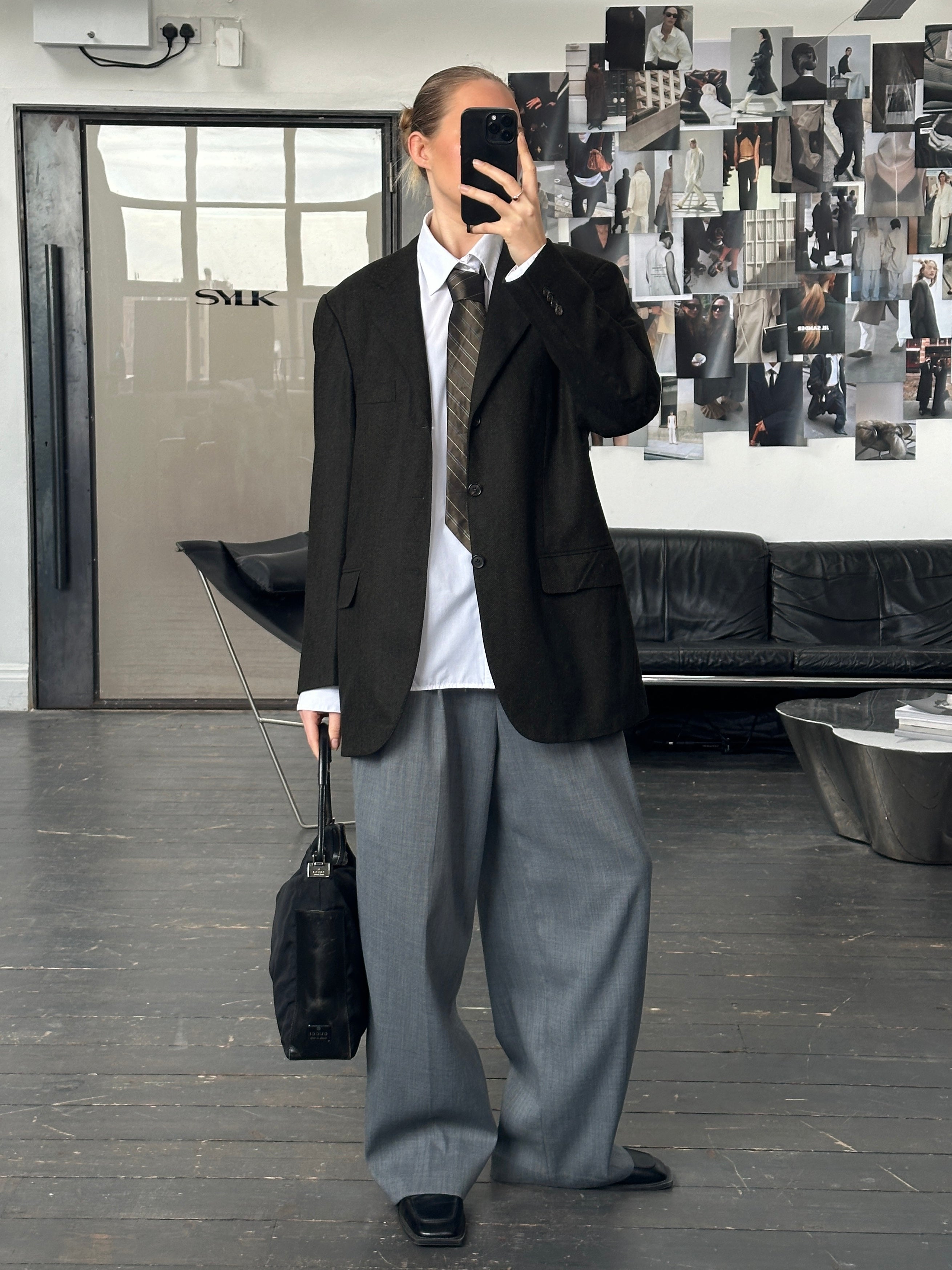 Loro Piana wool and cashmere herringbone blazer in size 42R/XL, showing tailored fit and classic pattern on a hanger.