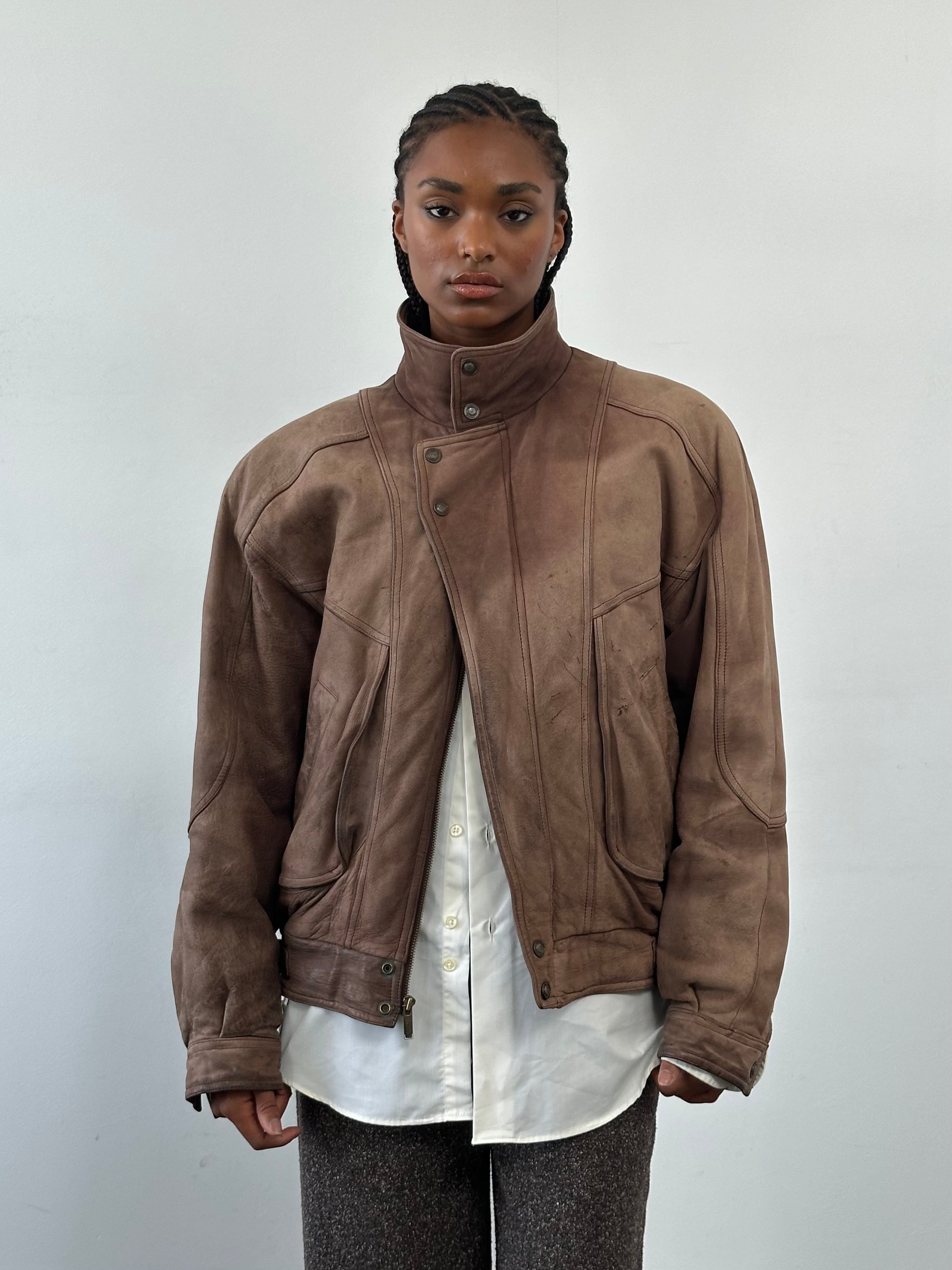Vintage 1990s high neck aged leather bomber jacket, men's size L, featuring classic design and distressed leather finish.