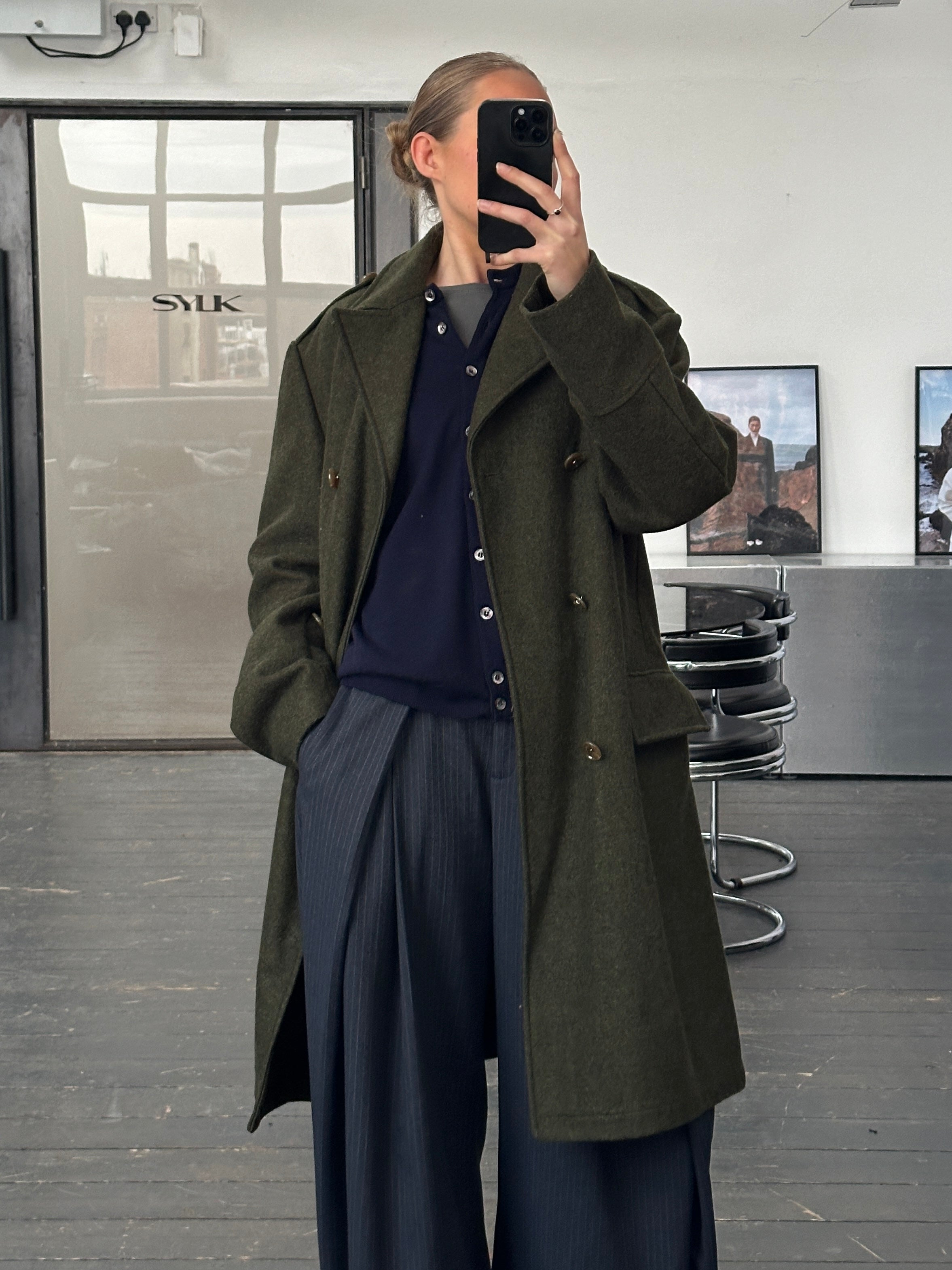 Dolce & Gabbana 1990s wool double-breasted coat in black, size L/XL, showing classic tailored design and luxurious fabric.