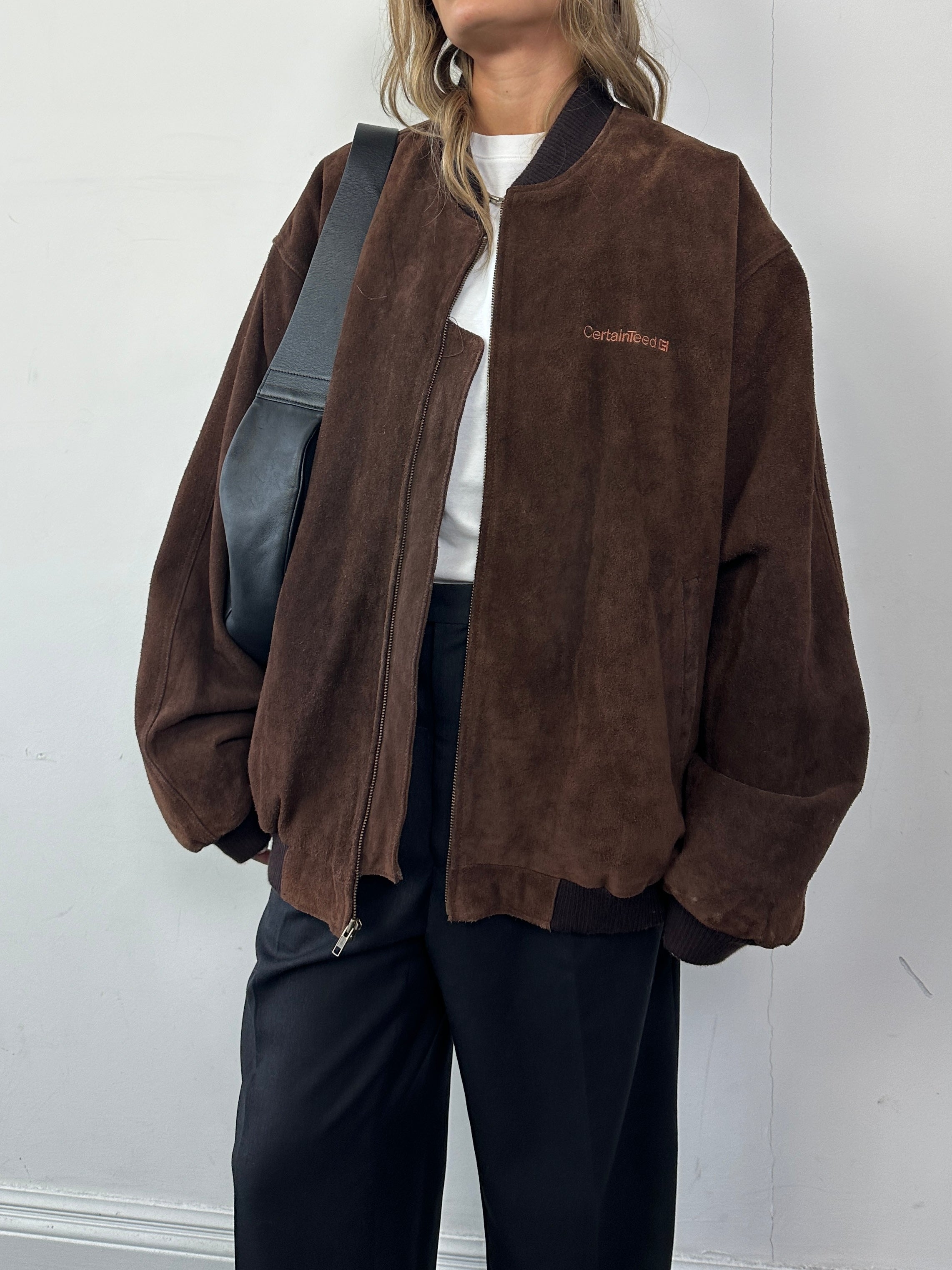 Vintage leather bomber jacket with suede embroidery in XXL size, featuring detailed embroidery and classic design.