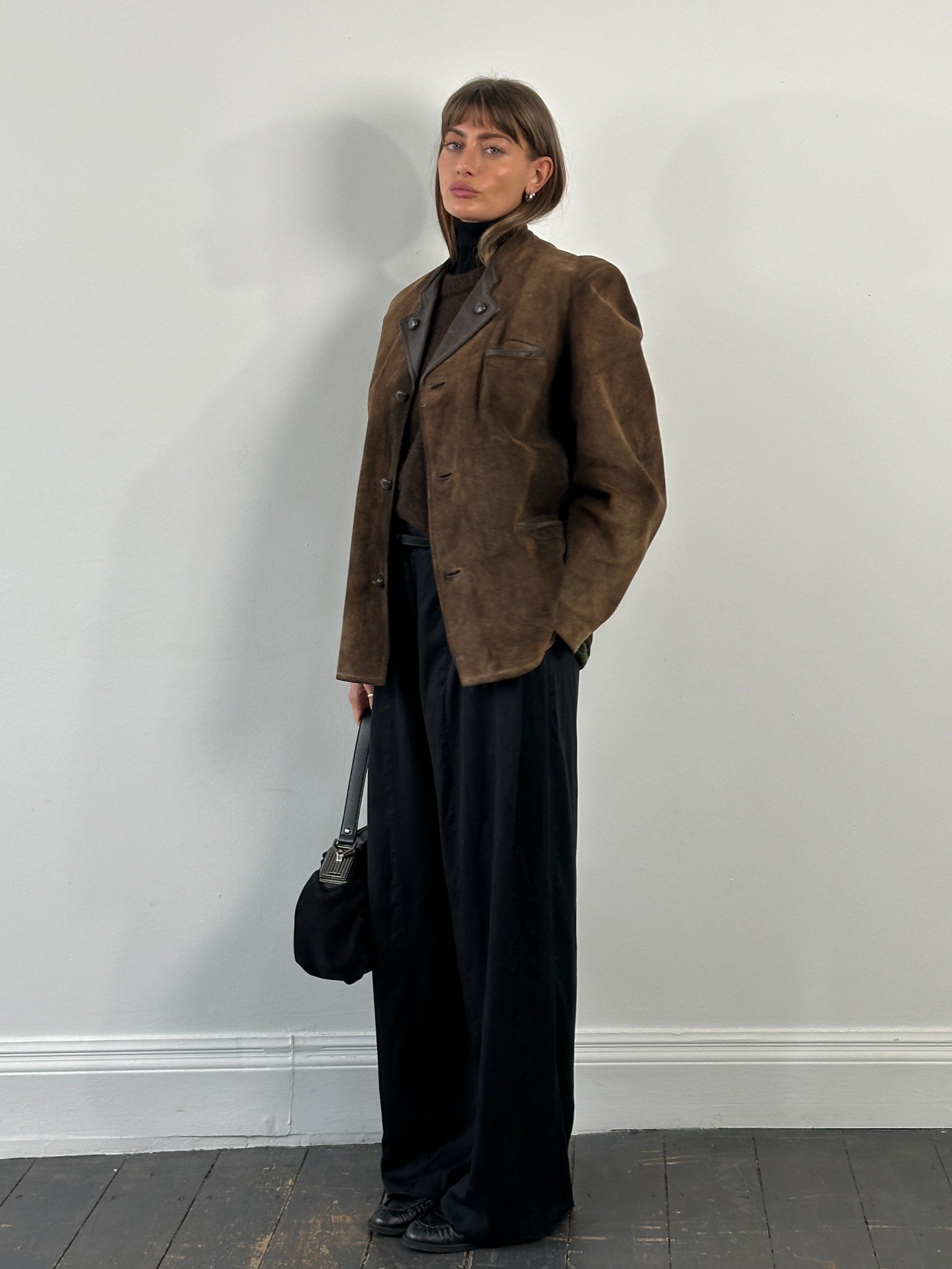 Vintage 1970s XL suede leather jacket featuring a classic design and soft, worn-in texture.