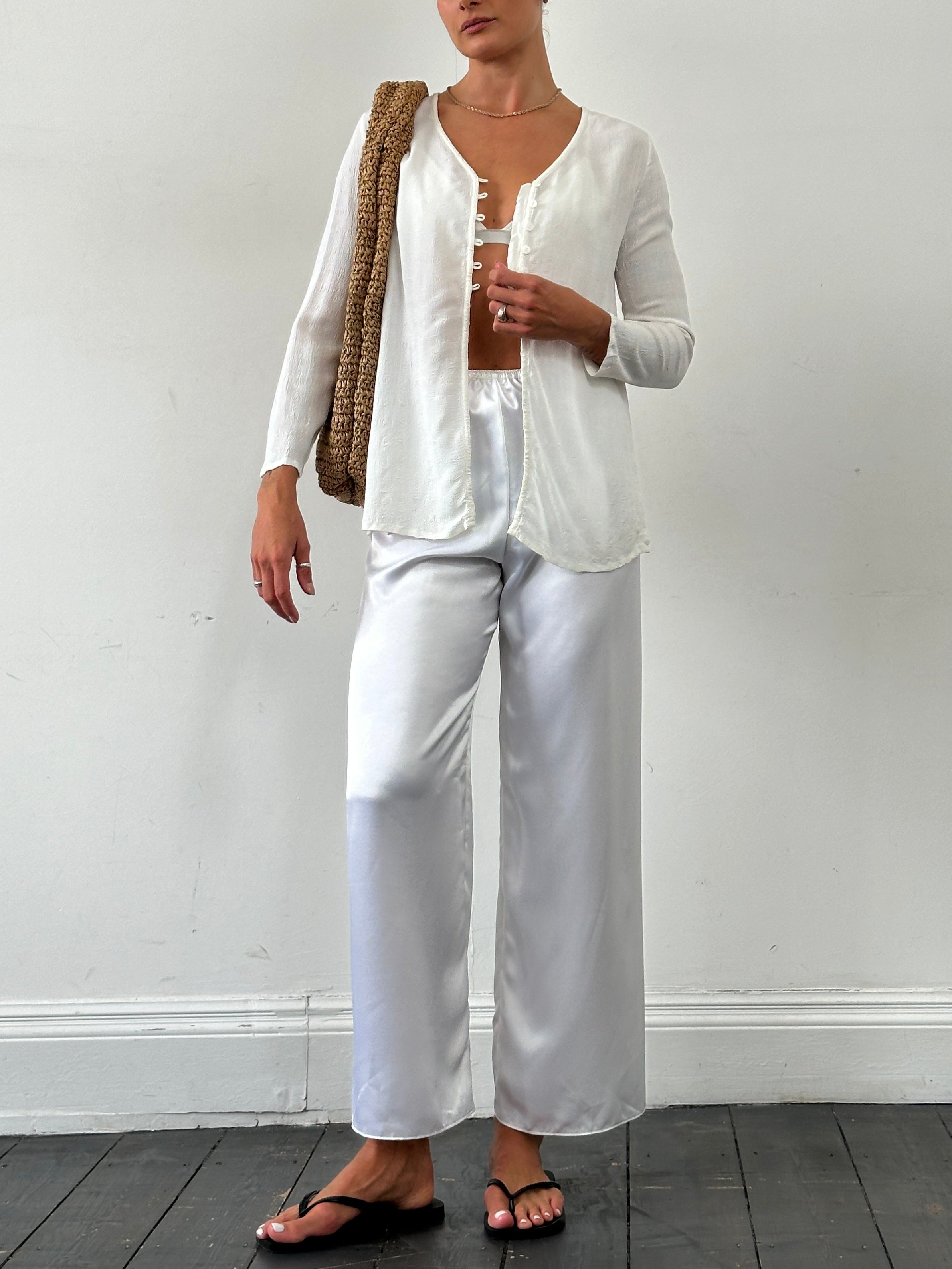 Laura Ashley textured collarless shirt in size M, shown in a close-up image highlighting fabric detail and stylish design.
