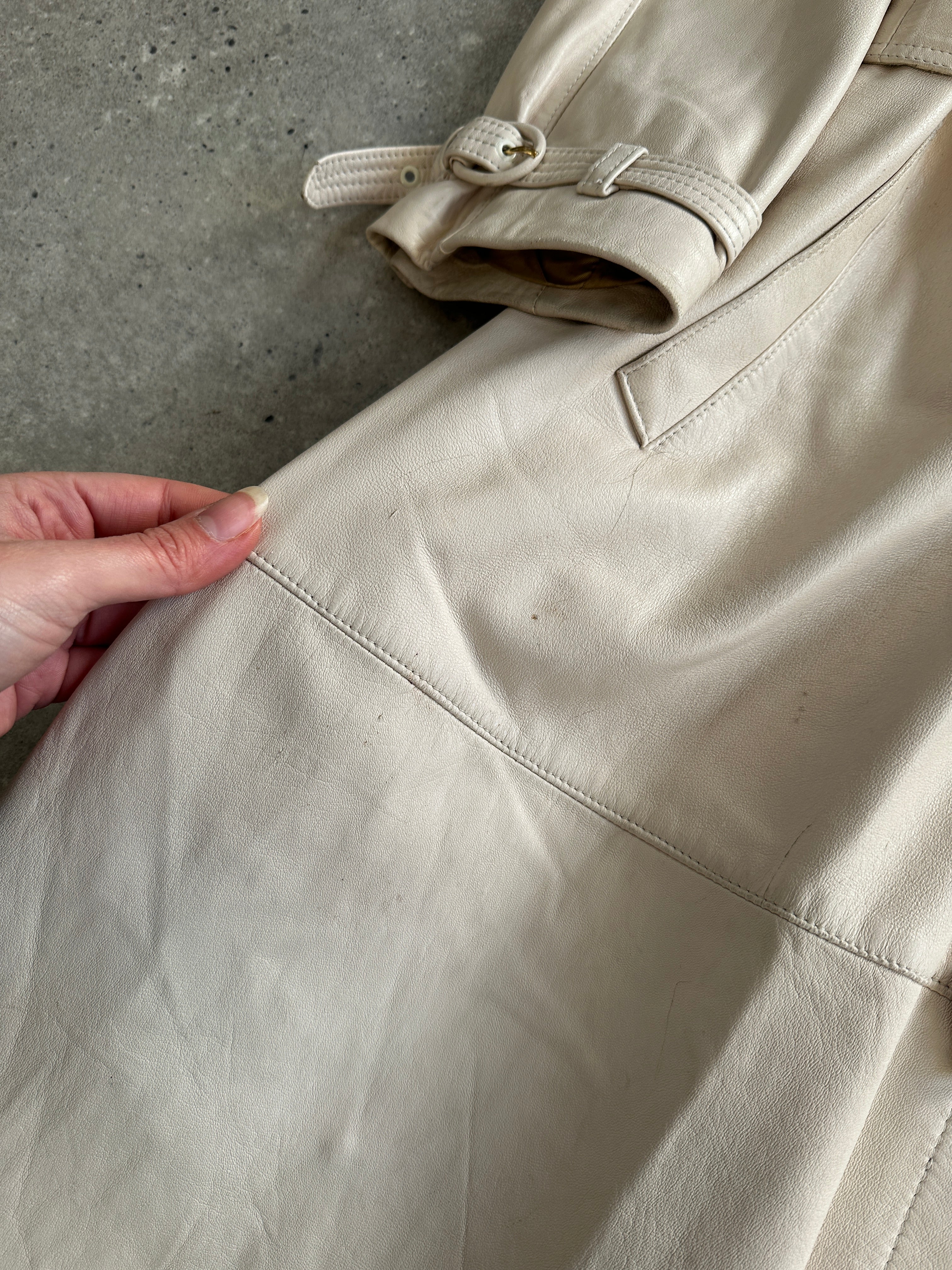 Vintage belted leather trench coat, classic leather jacket style with waist belt, in M/L size, stylish and timeless outerwear