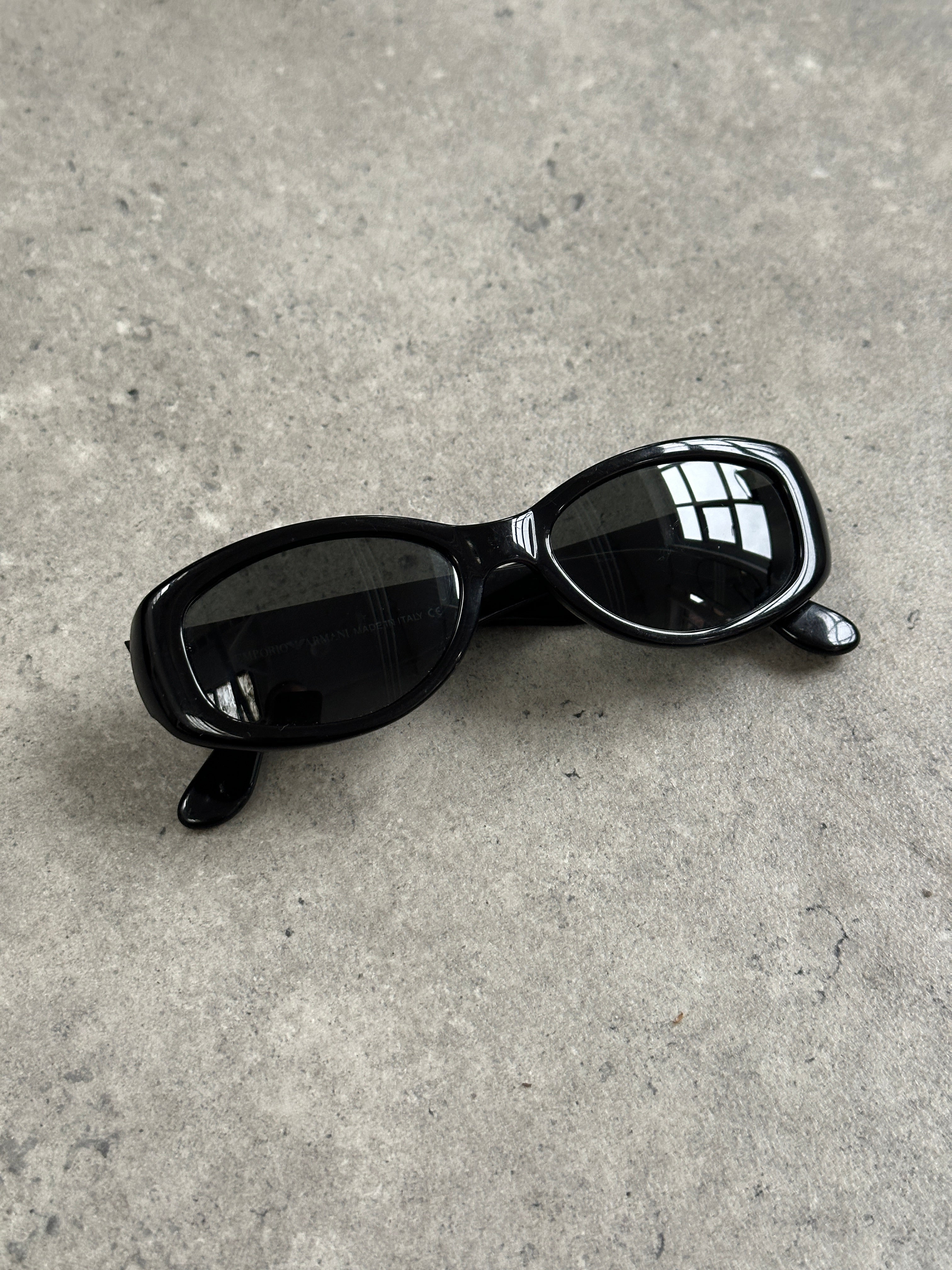 Emporio Armani 2000s oval sunglasses with black frames and dark lenses, stylish and modern eyewear for fashion-forward looks.