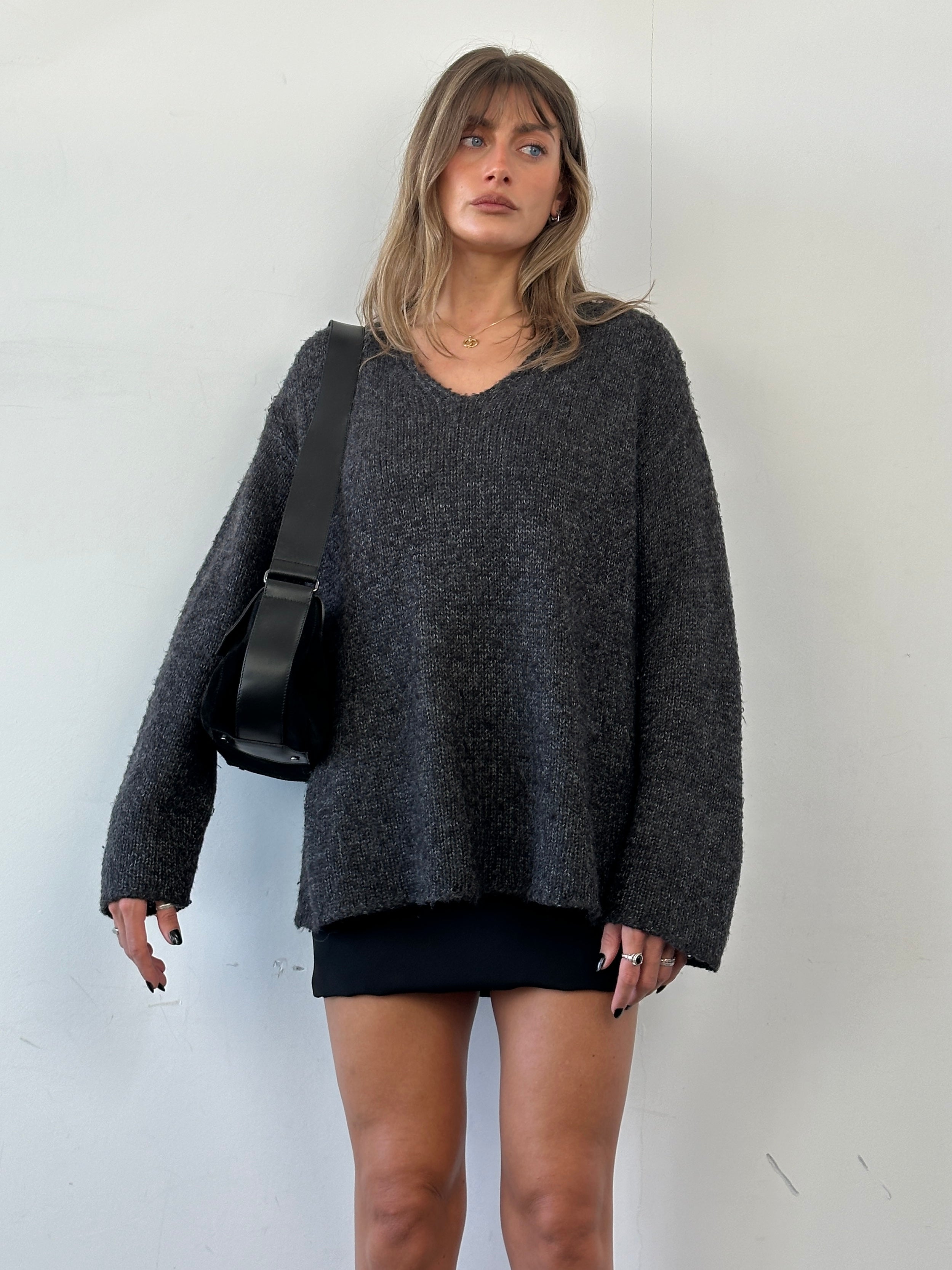 Max Mara XL mohair v-neck knitted jumper displayed flat, showcasing its soft texture and classic design.