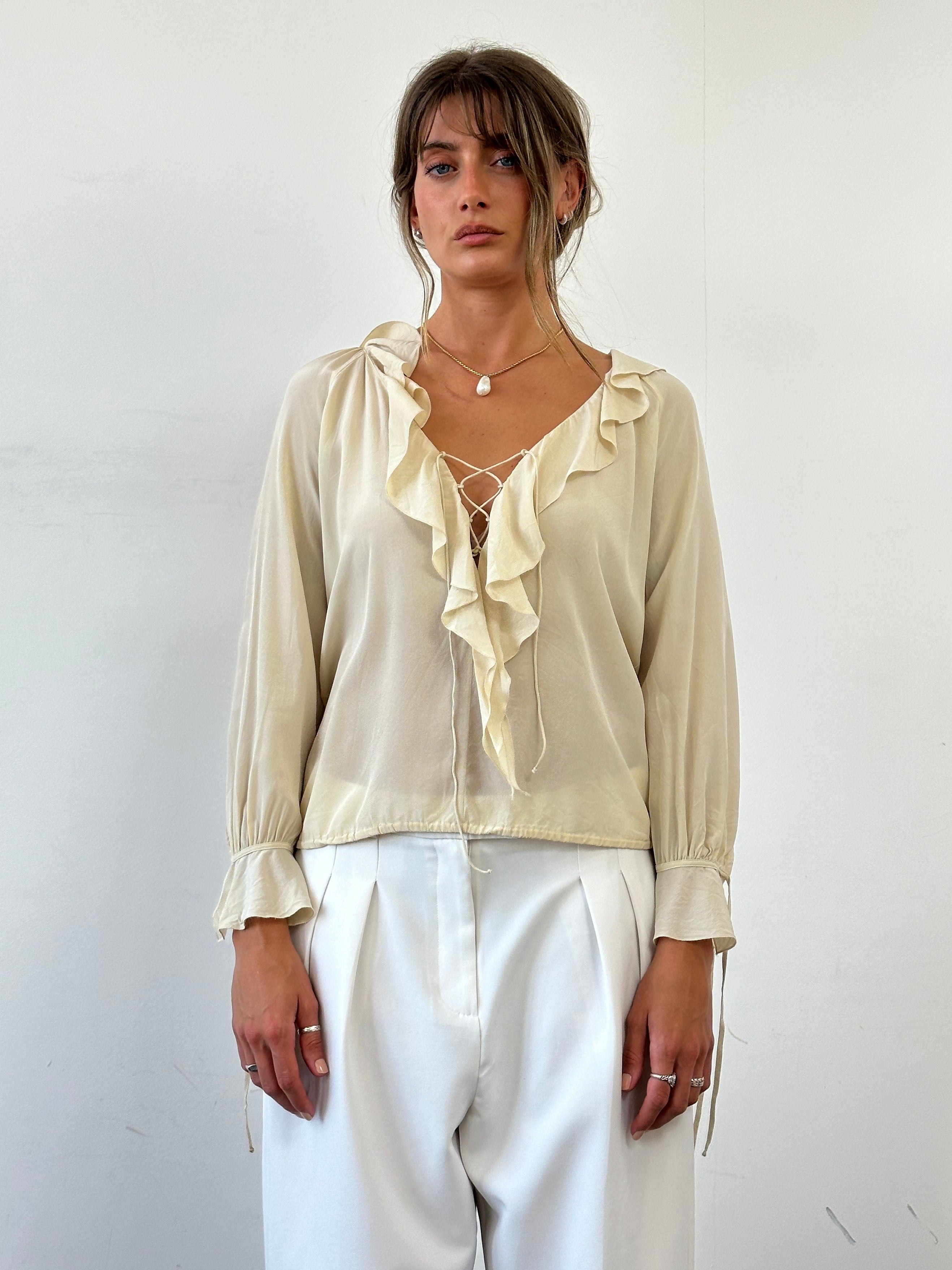 Max Mara pure silk ruffle tie-front blouse in S/M, showcasing elegant design and soft fabric details.