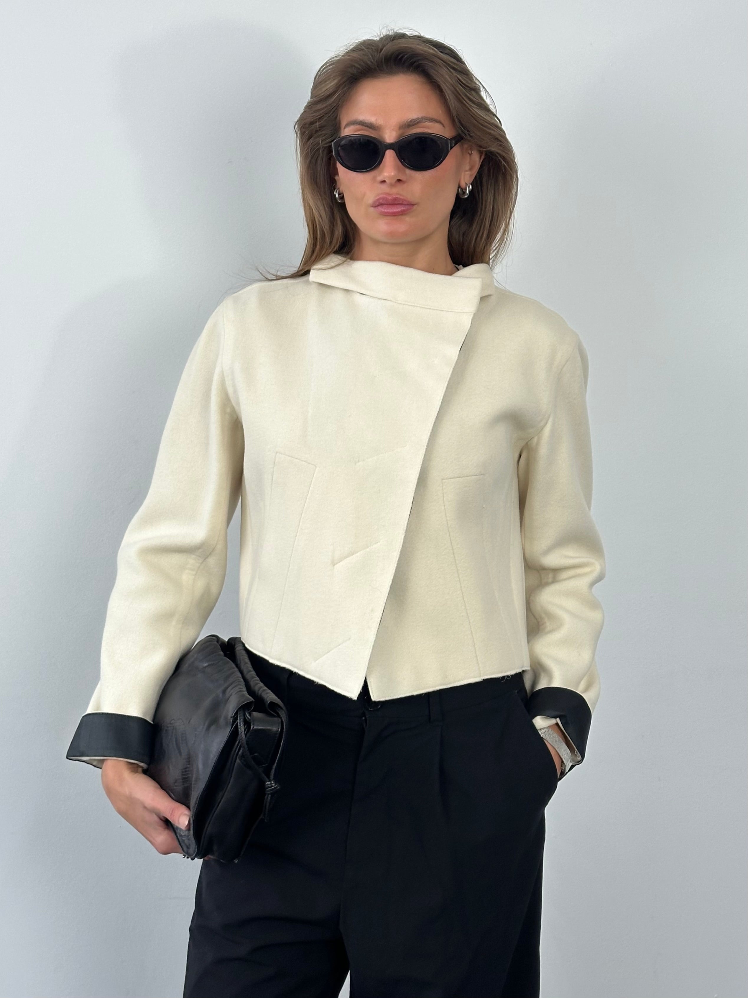 Donna Karan 2000s pure wool cropped jacket, stylishly tailored, with a classic design and button details, in a versatile neutral color.