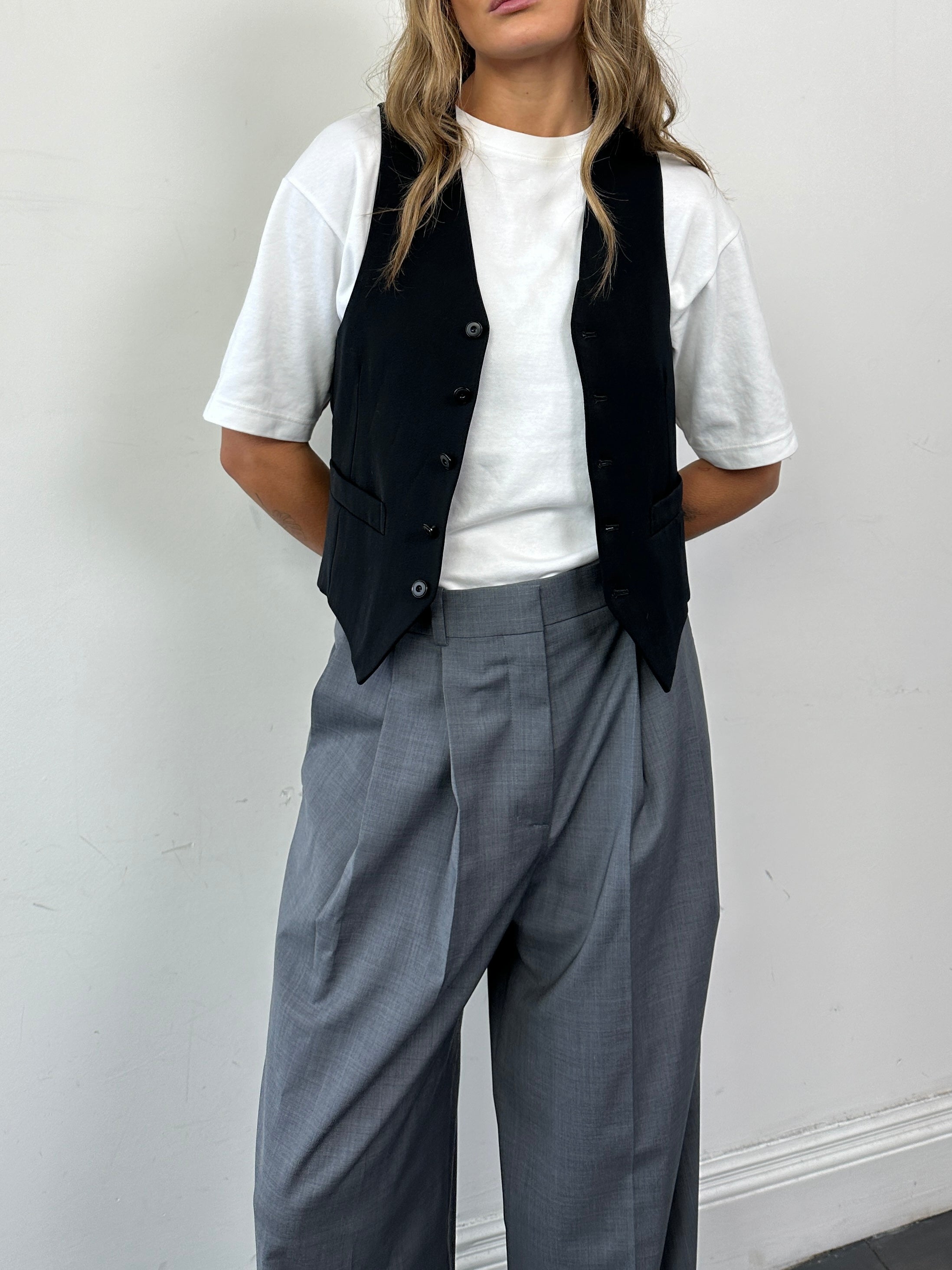 Vintage wool blend tailored waistcoat in size M, featuring classic design and detailed stitching.