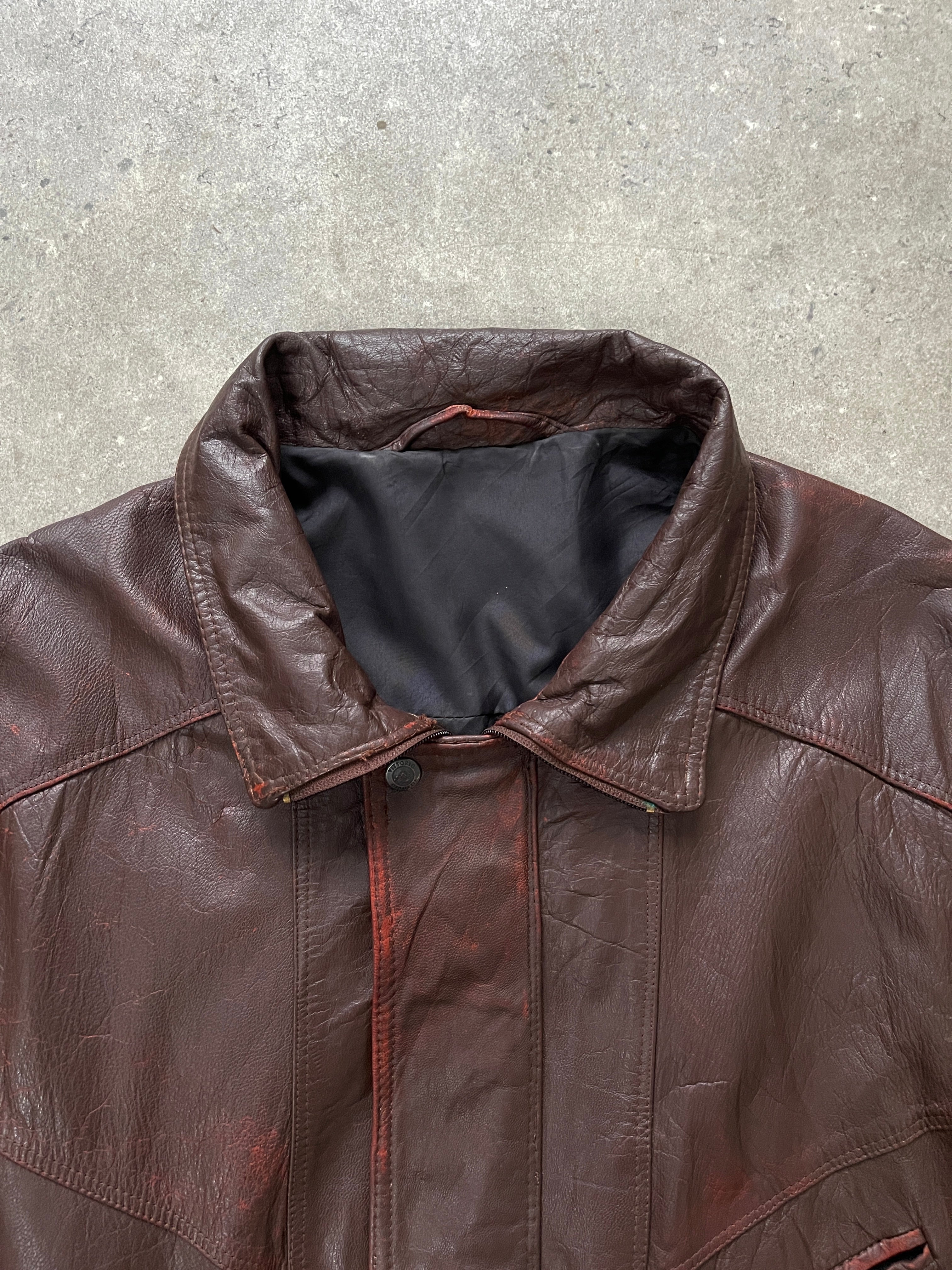 Vintage 1990s men's aged leather bomber jacket with funnel neck, size XL, showcasing distressed brown leather and classic style.