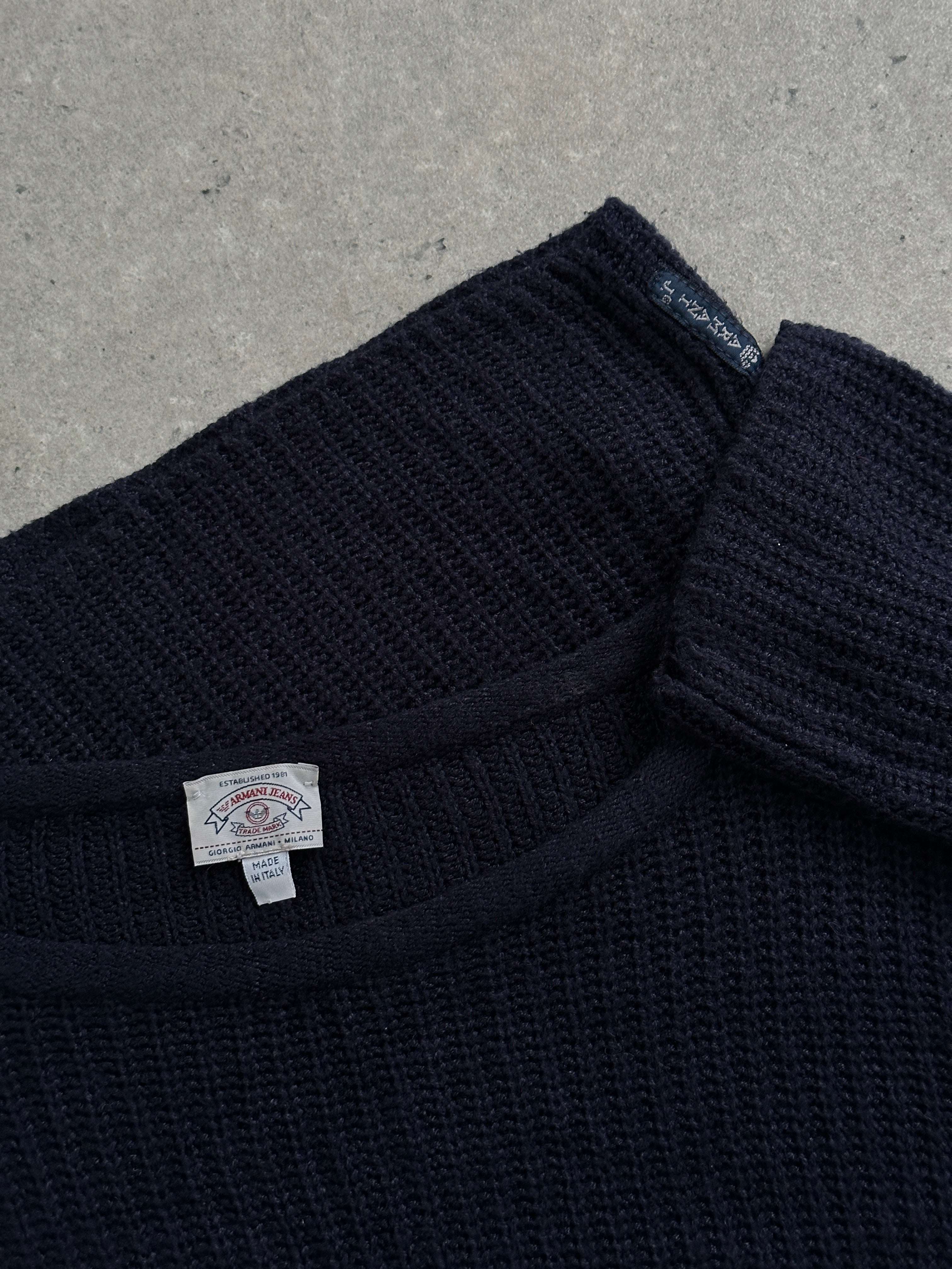 Armani Jeans 1990s cropped knitted jumper in black, featuring a fitted design and ribbed cuffs, perfect for casual styling.