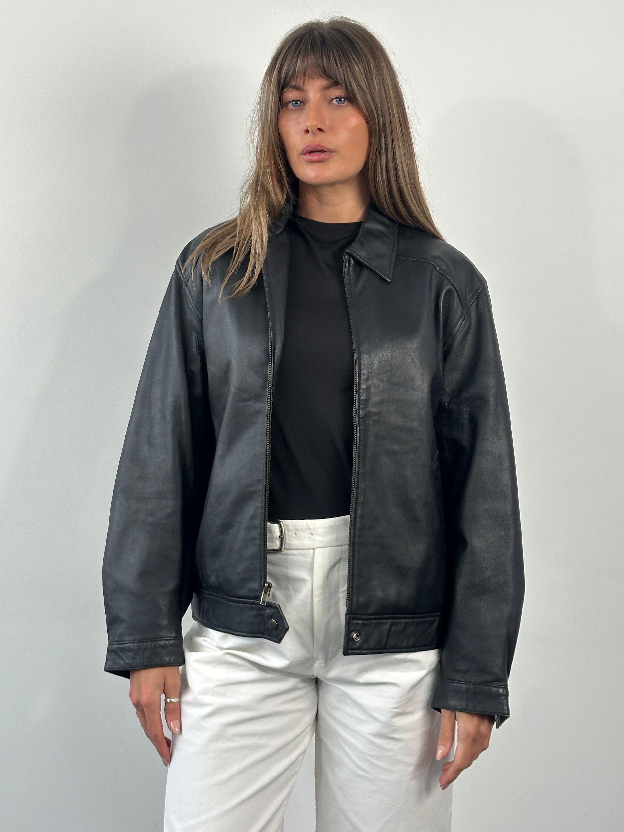 Vintage 1990s leather bomber jacket with classic design, shown in dark brown leather, size Small/Medium, from the Vintage brand.