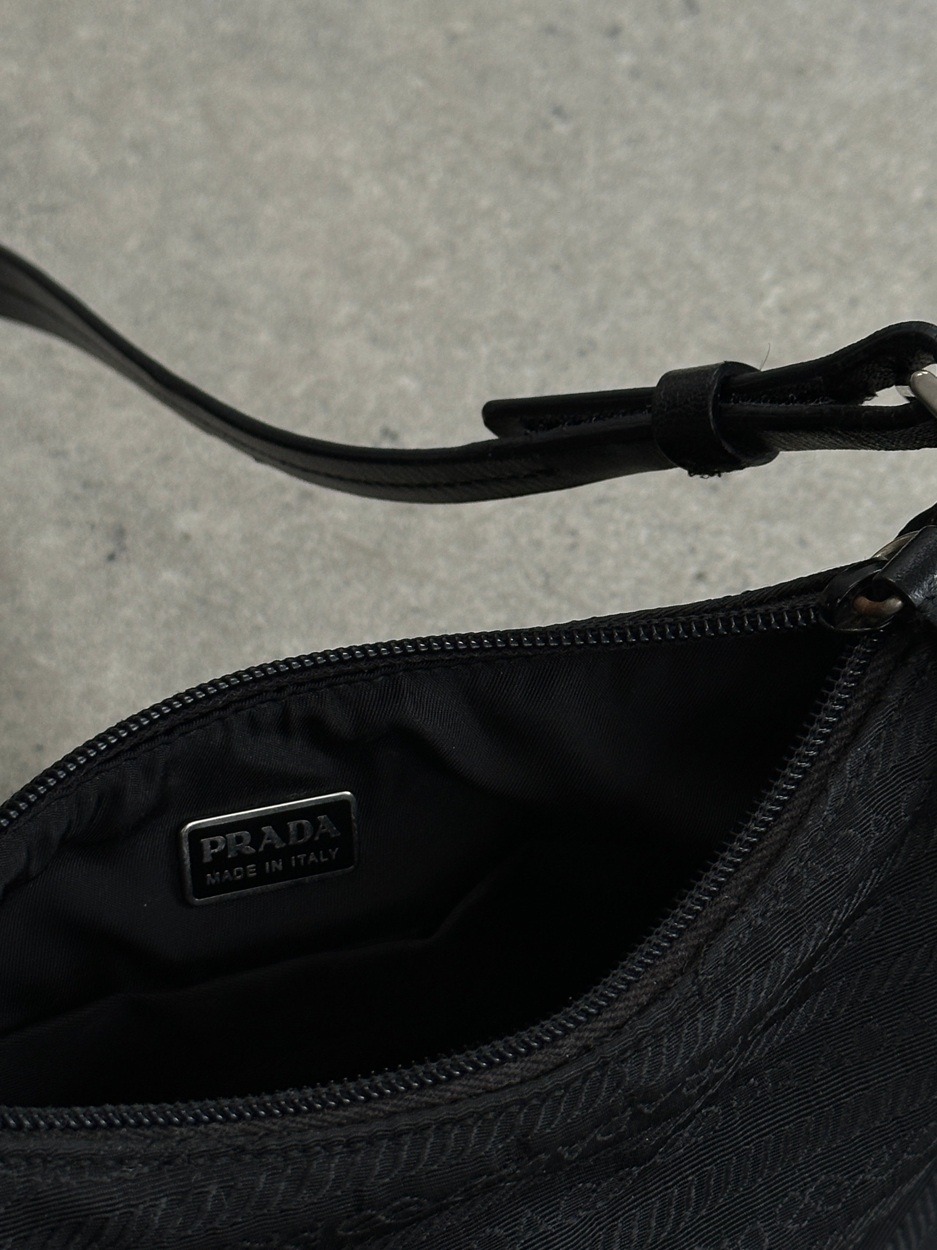 Prada nylon Tessuto monogram crossbody bag with adjustable strap and Prada logo, featuring a sleek, durable design.