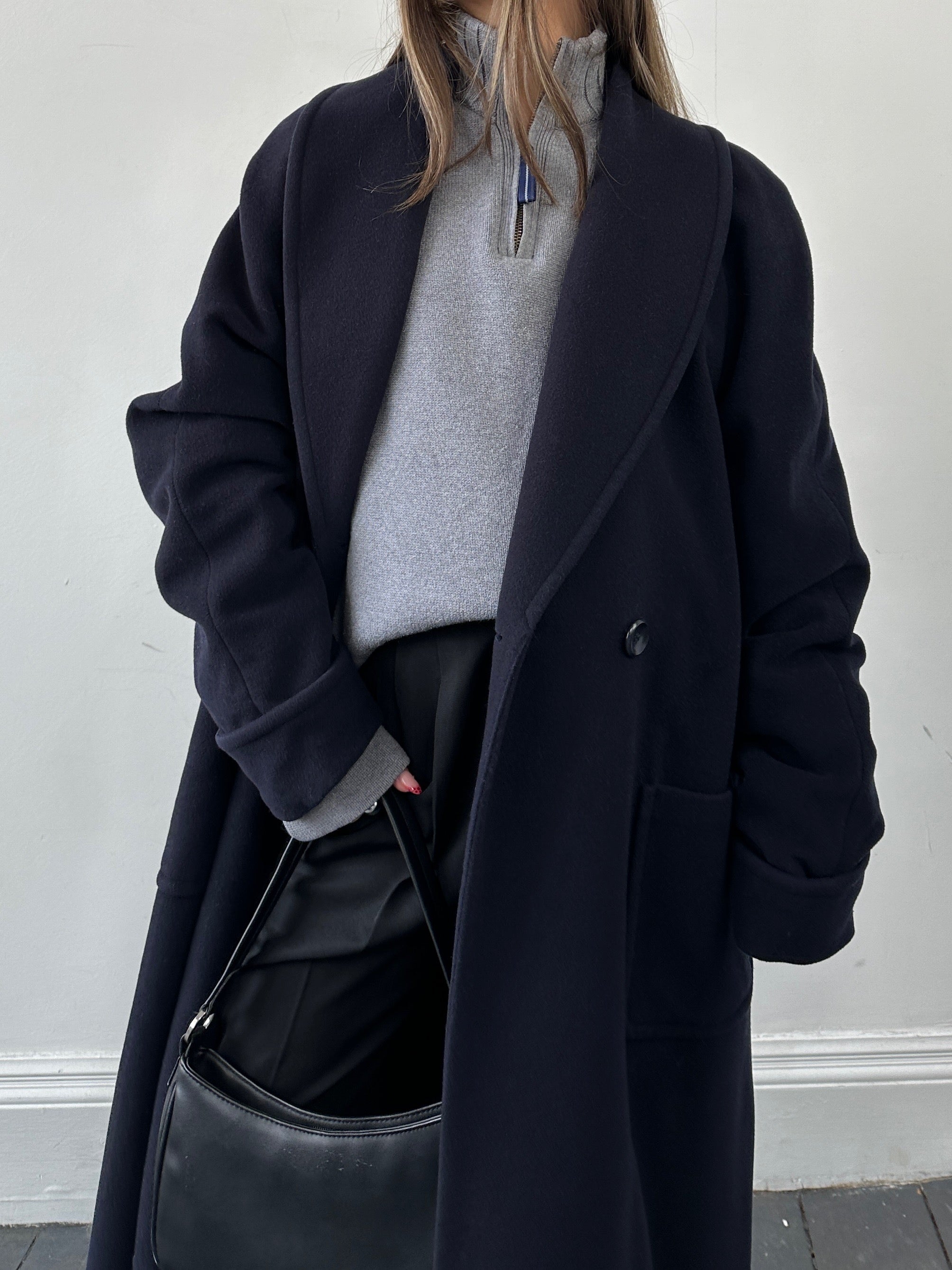 Vintage wool double-breasted coat in size M, featuring classic design and tailored fit, shown on a neutral background.