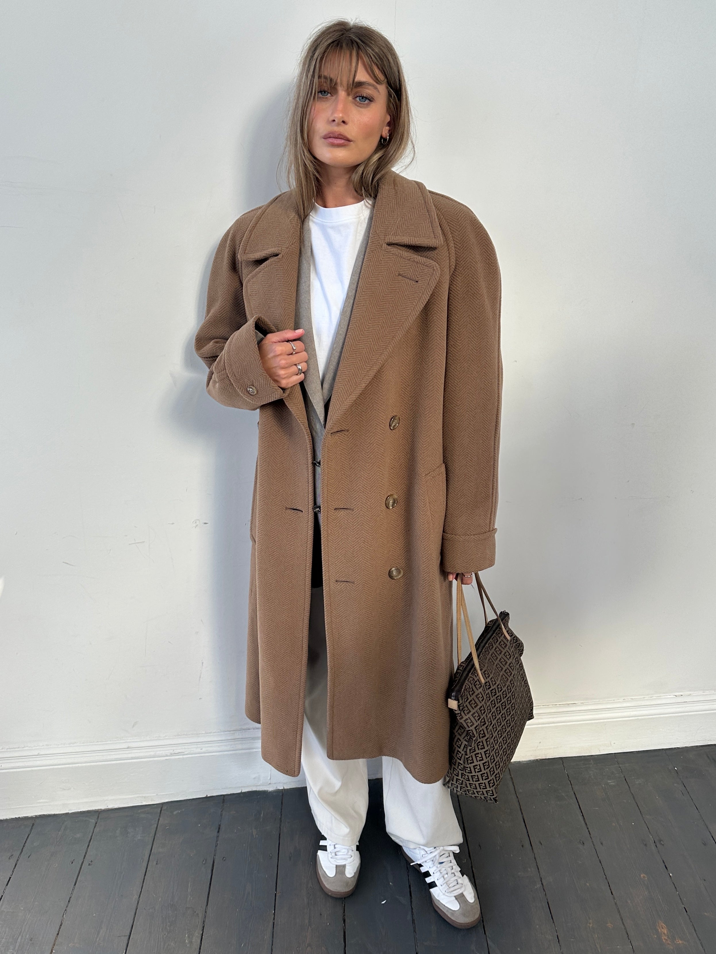Christian Dior belted double-breasted wool coat in size L, showcasing classic design and tailored fit.