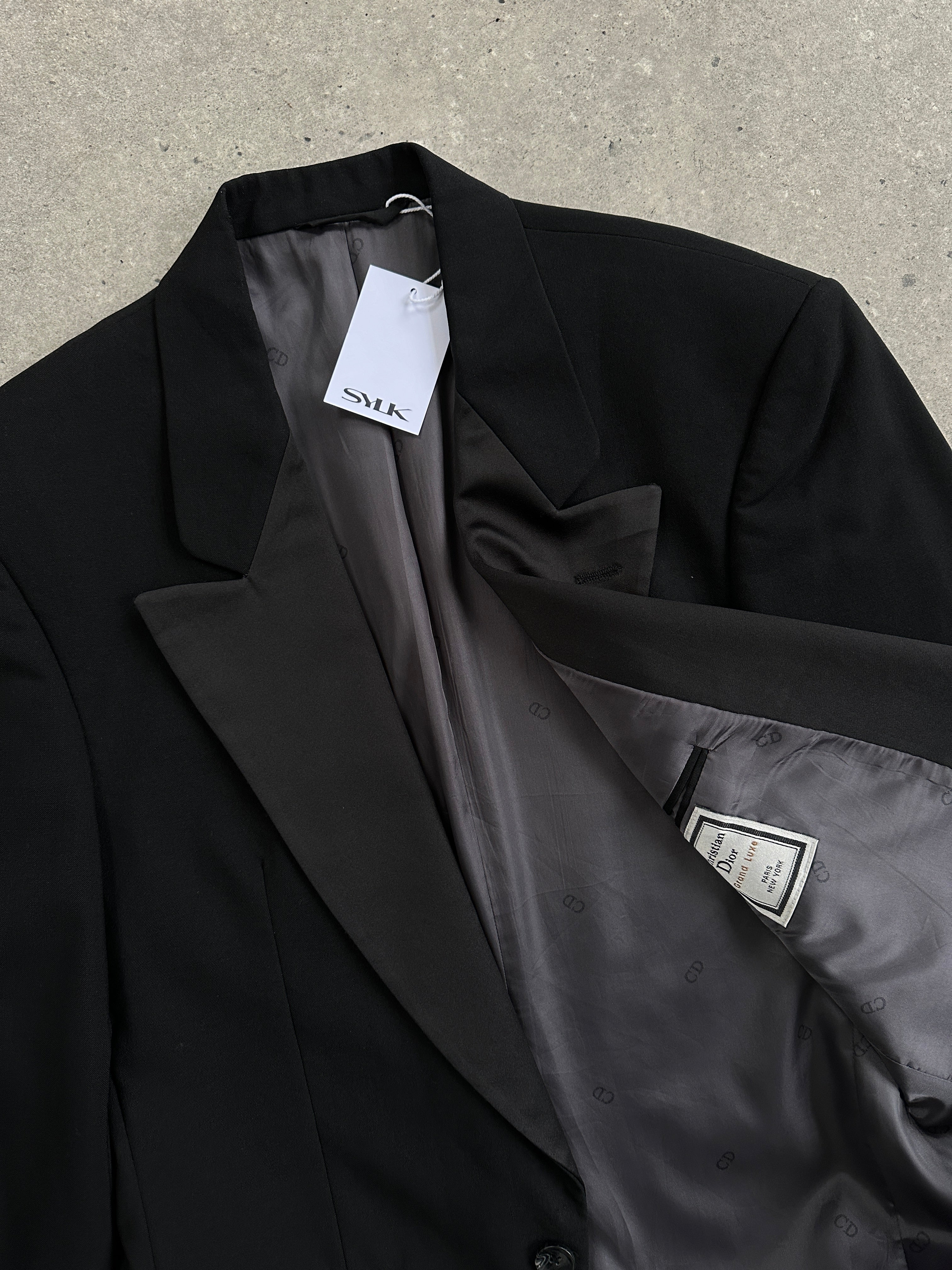 Christian Dior wool tuxedo blazer, single-breasted, in size 36R/XS, featuring classic lapels and tailored fit.