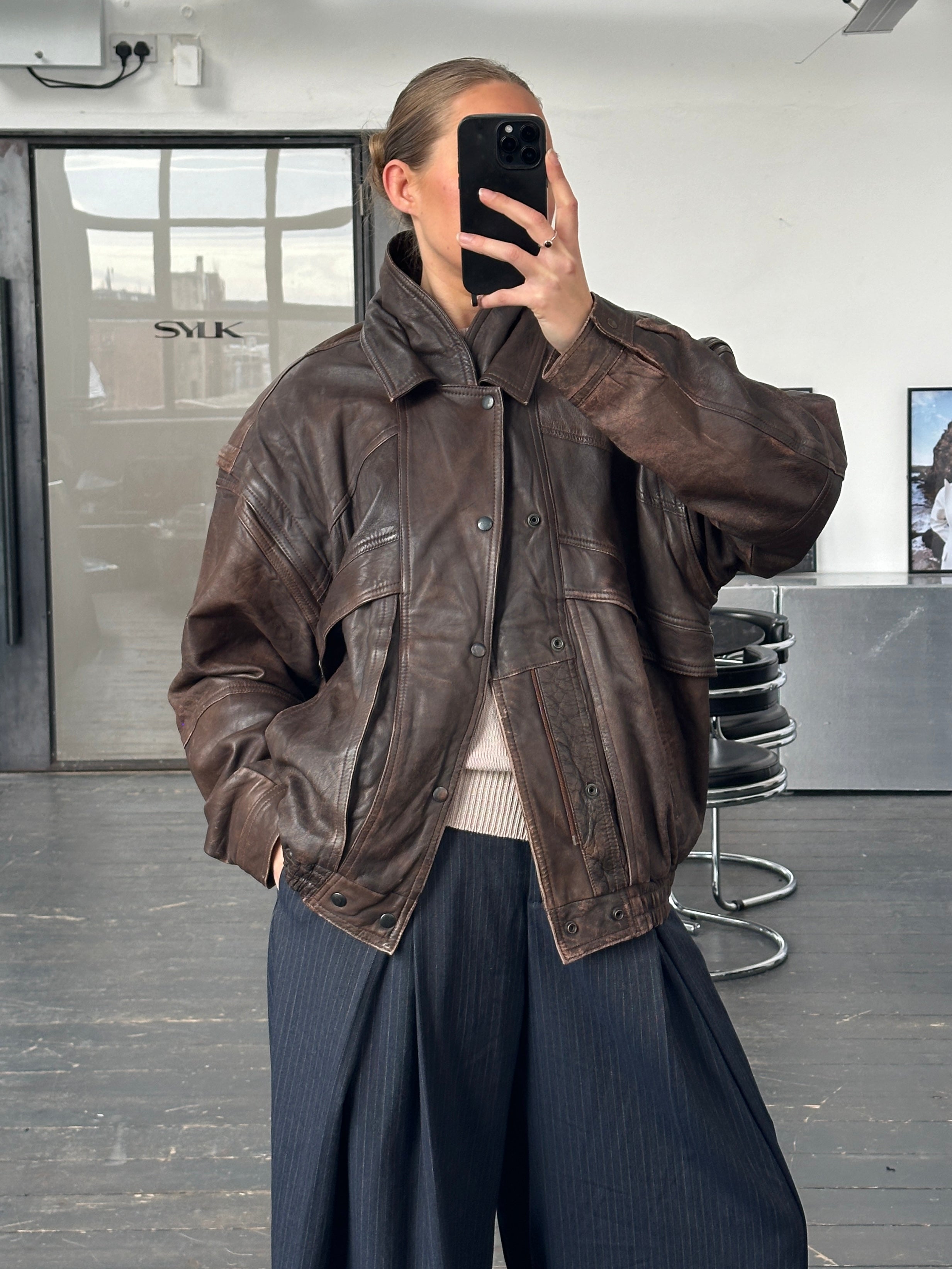 Vintage 1990s aged leather bomber jacket with double collar in XL size, featuring a classic distressed leather look.